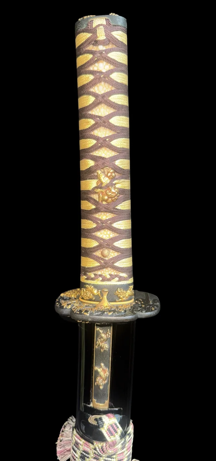 Close-up of Jūyō Tōken Wakizashi by Shume no Kami Ippei Yasuyo hilt with gold Tokugawa Aoi crest details