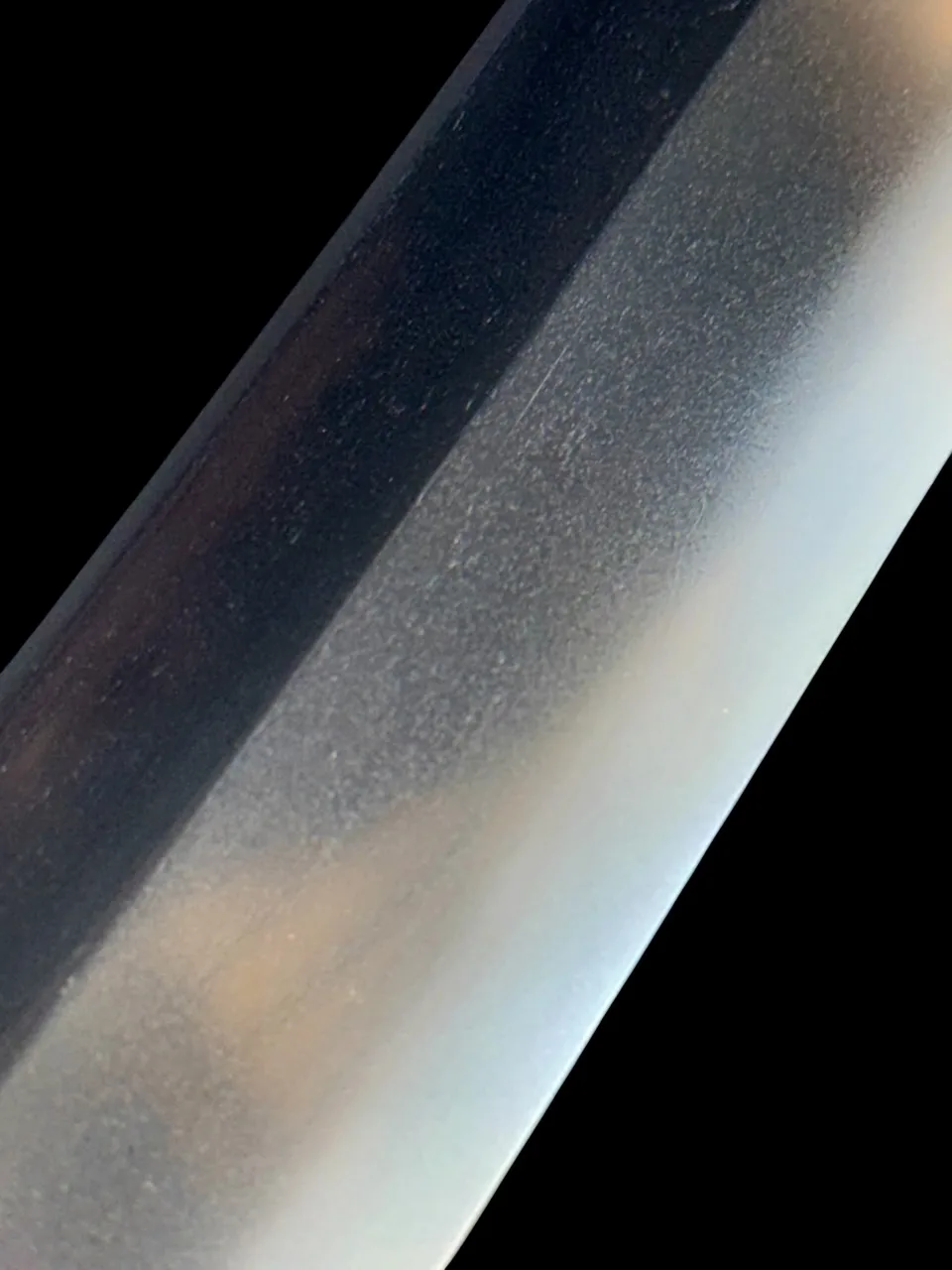 Close-up of the Jūyō Tōken Wakizashi by Shume no Kami Ippei Yasuyo blade, showing texture and detail