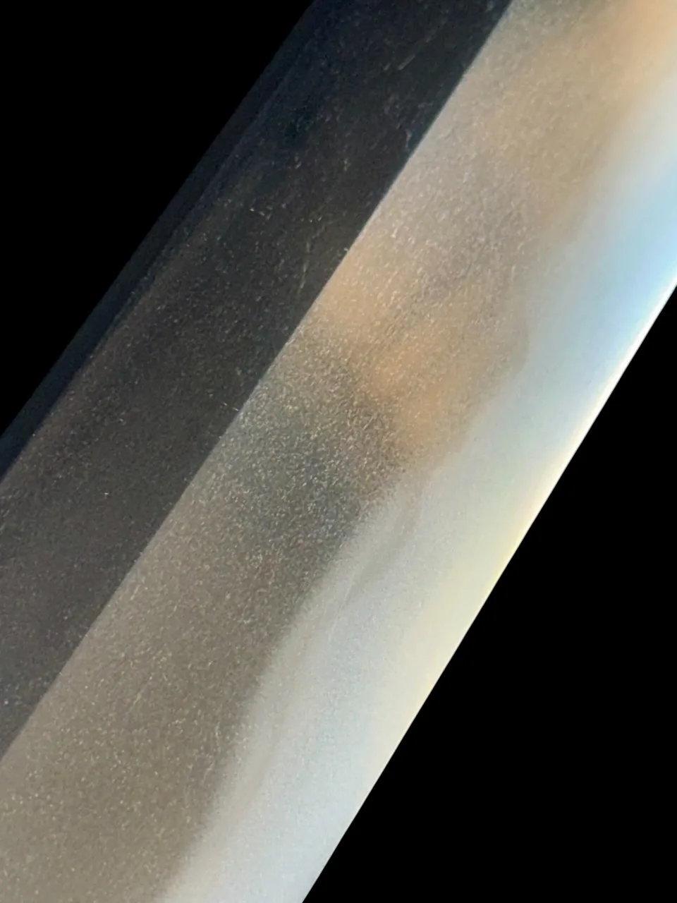 Close-up of the polished ha of the Jūyō Tōken Wakizashi by Shume no Kami Ippei Yasuyo samurai sword