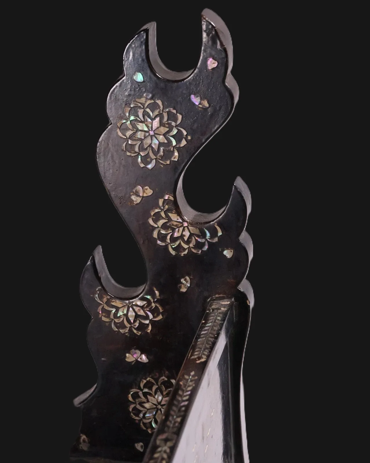 Close-up of Antique Japanese Silver Kake Three Sword Katana Kake accessory, showing mother-of-pearl raden floral inlay.