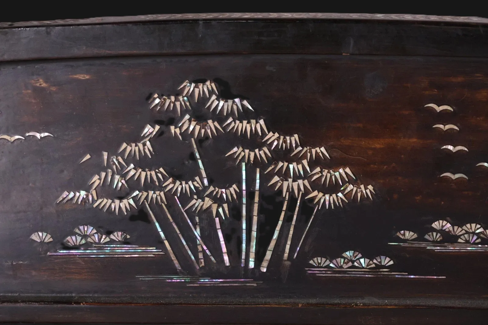 Close up of the Antique Japanese Katana Kake showing mother-of-pearl bamboo, birds, and fans on the drawer panel.