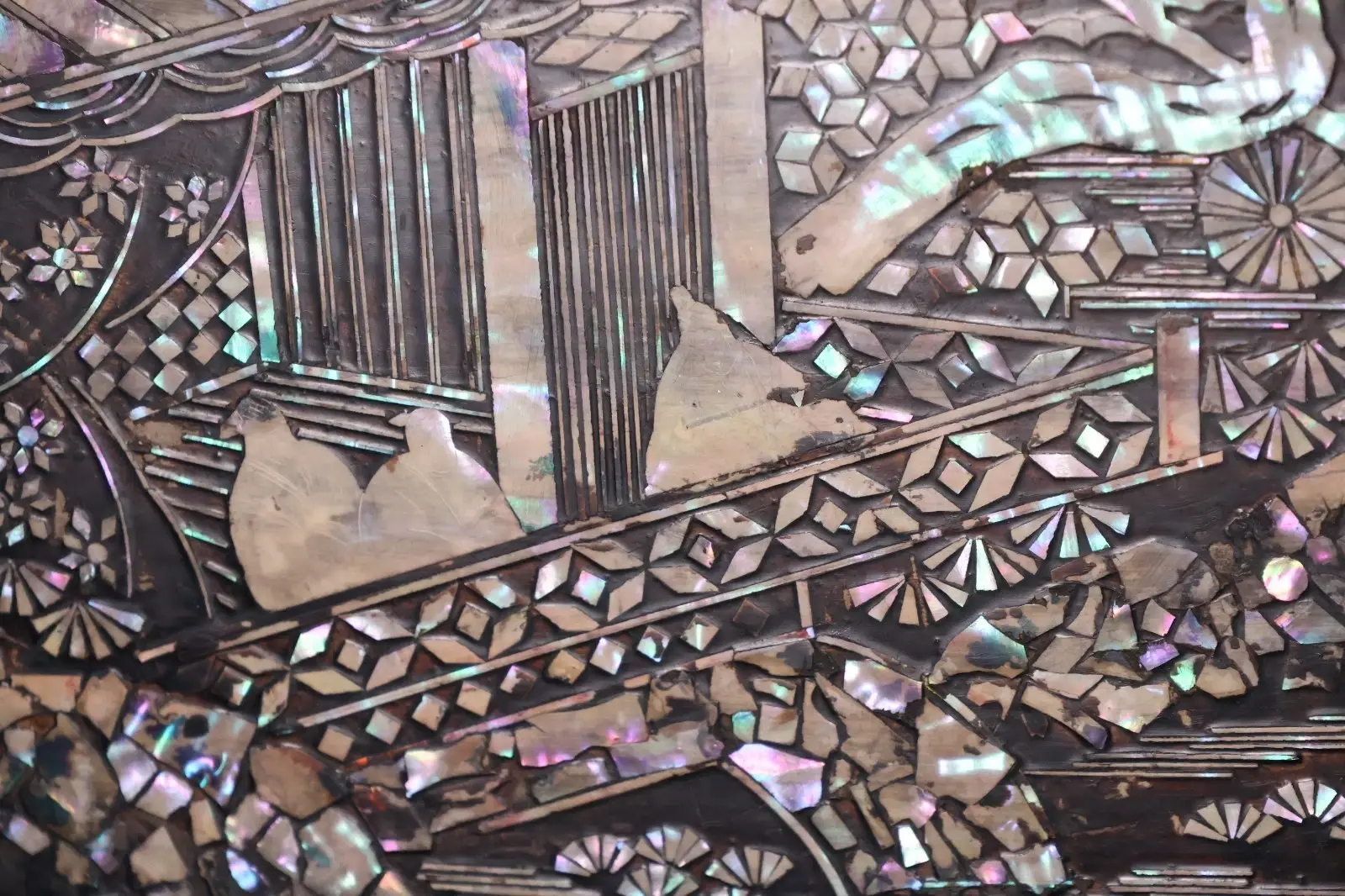 Close-up of intricate raden mother-of-pearl inlay on an Antique Japanese Silver Katana Kake Accessories piece from Meiji.