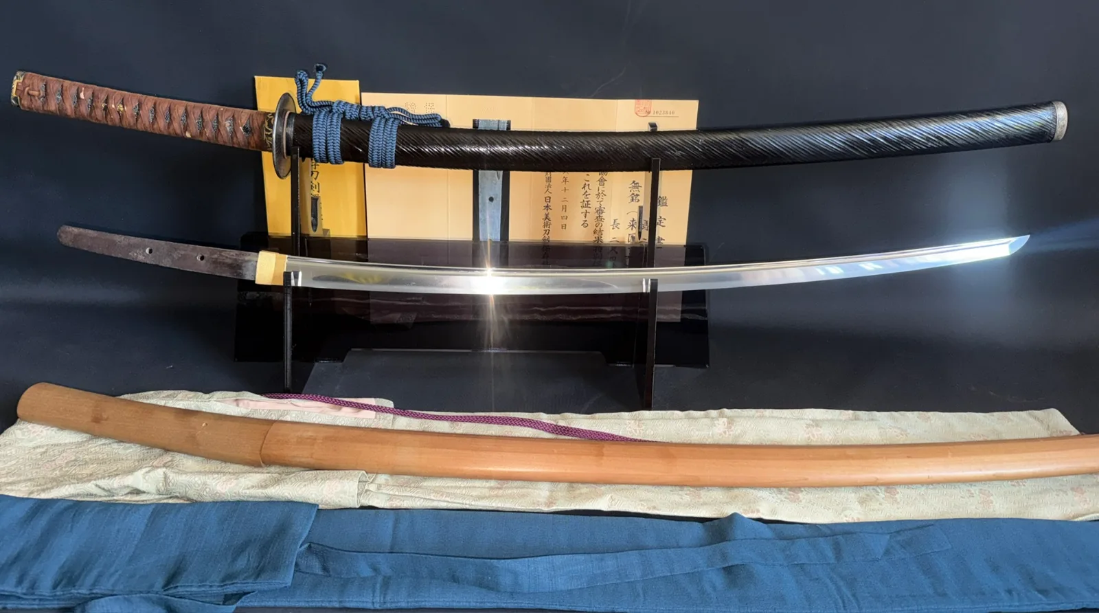 Kamakura Katana Sword Attributed to Rai Kunizane, a polished katana blade and mounted hilt on display