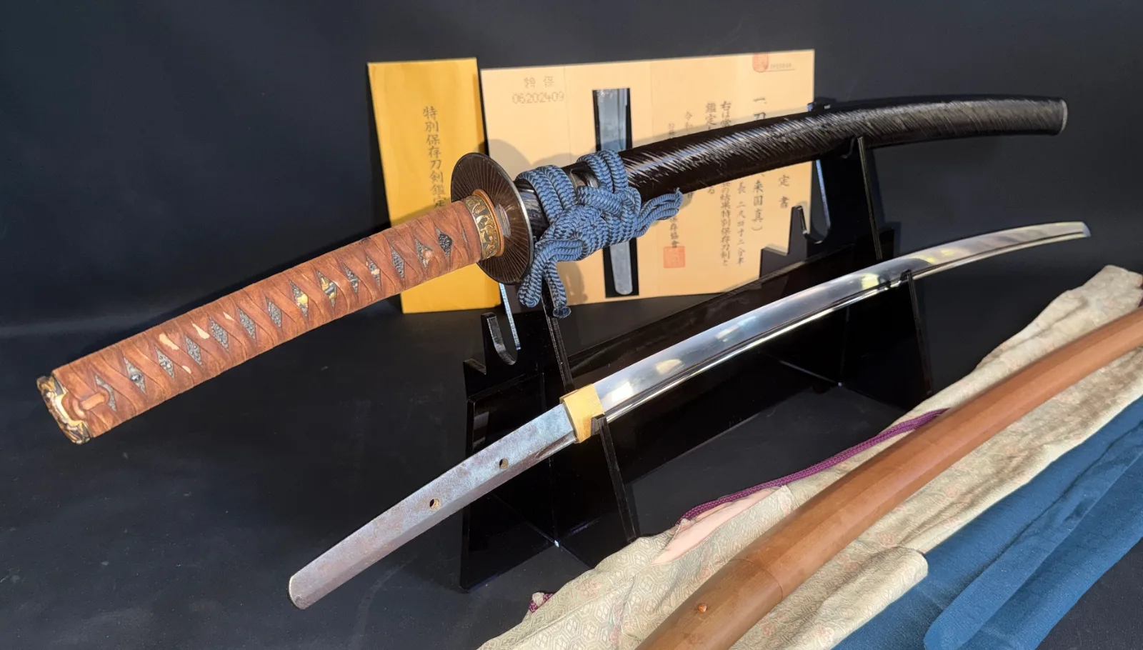 Kamakura Katana Sword Attributed to Rai Kunizane, a samurai sword on a stand with visible tang