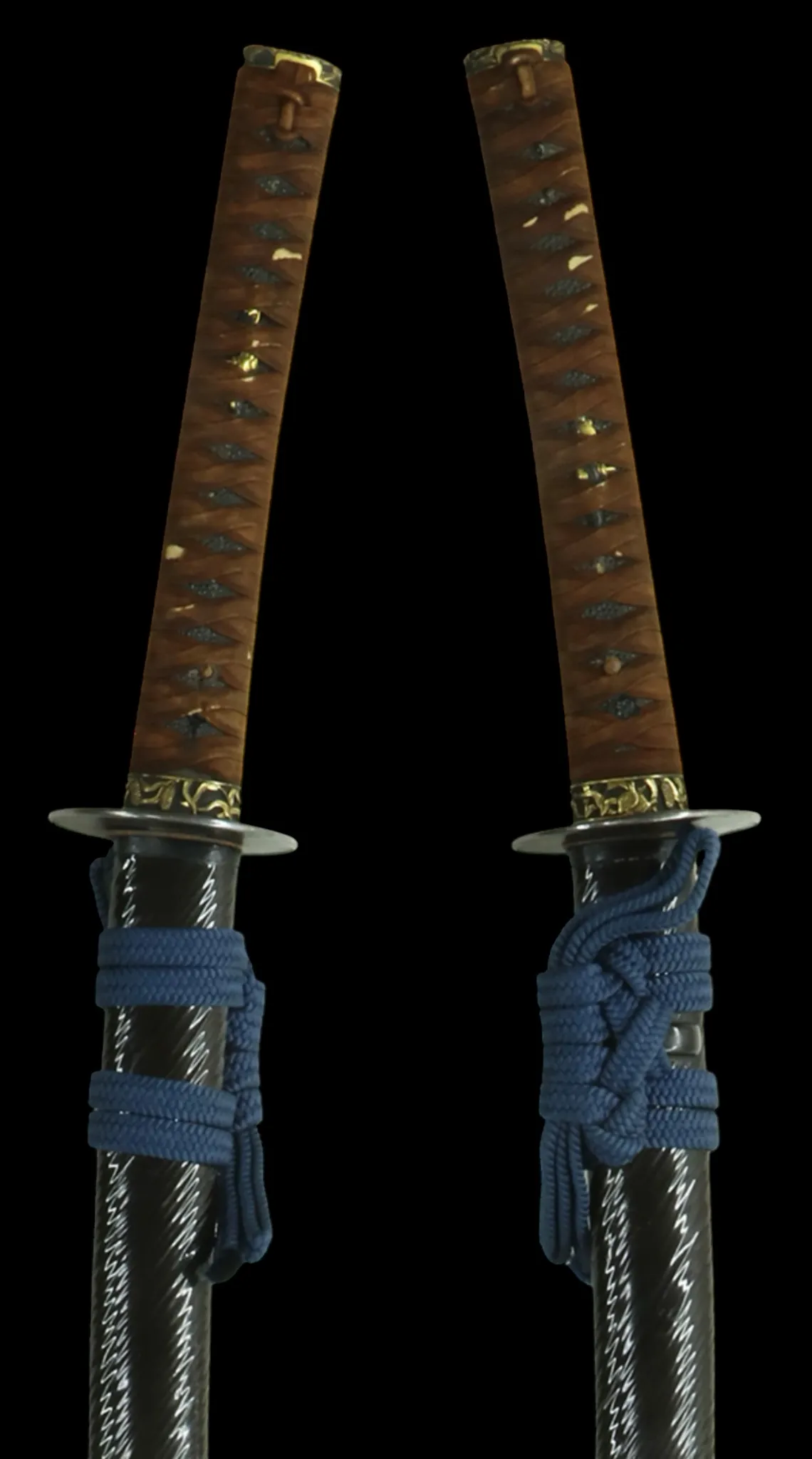 Kamakura katana sword attributed to Rai Kunizane, two scabbarded swords with blue saya cords, oblique angle