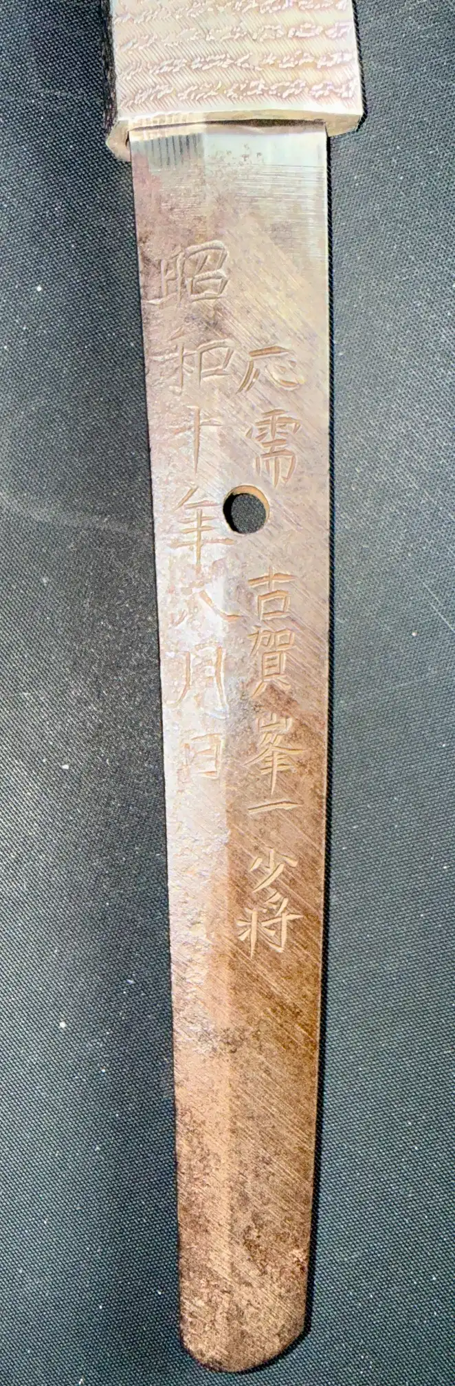 Close-up of a Naval Commissioned Gendaitō katana tang with engraved Japanese characters from Kyodai Originals.