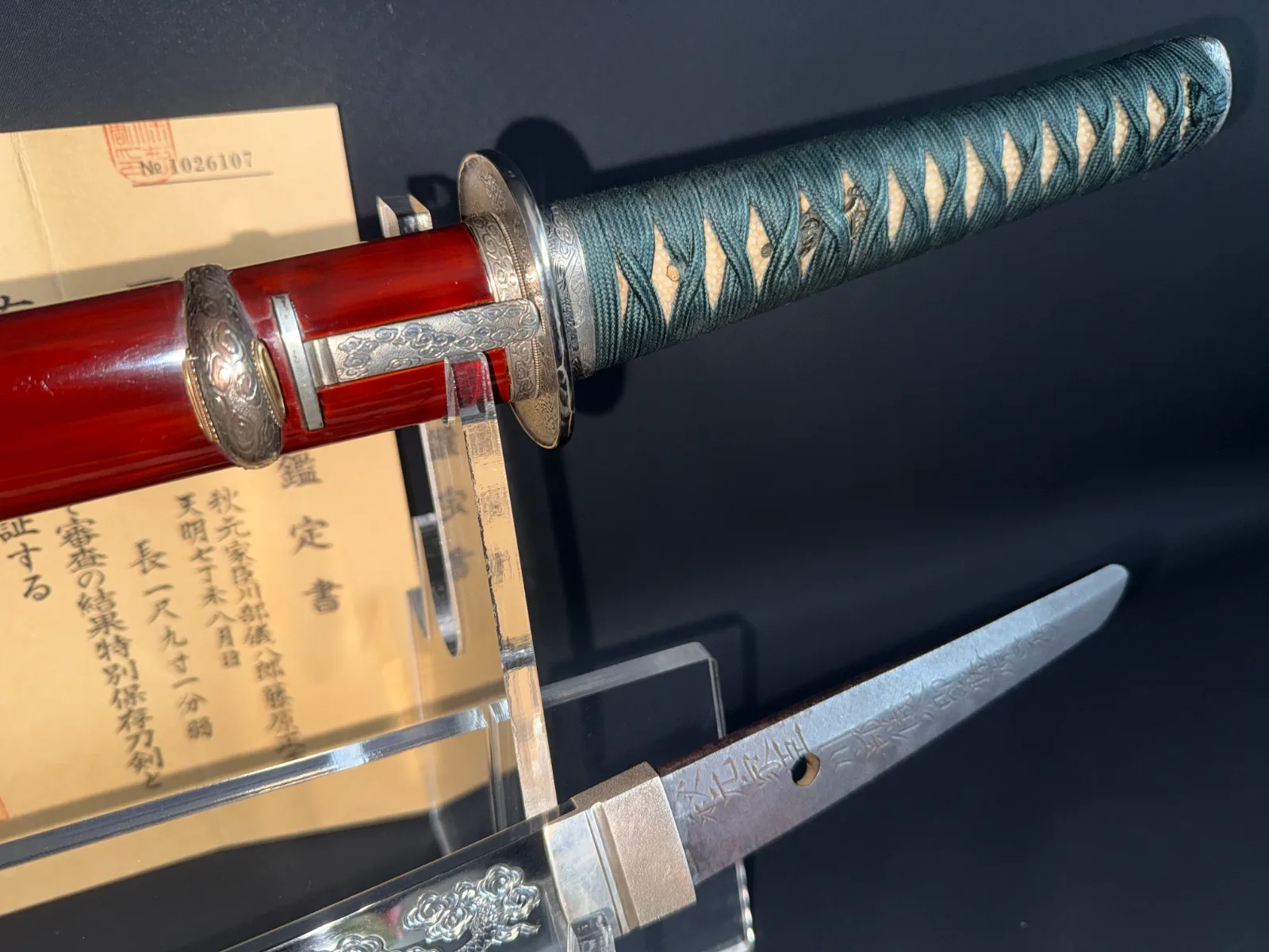 Suishinshi Masahide Wakizashi NBTHK Tokubetsu Hozon, showing blade inscription, red saya, and green tsuka.