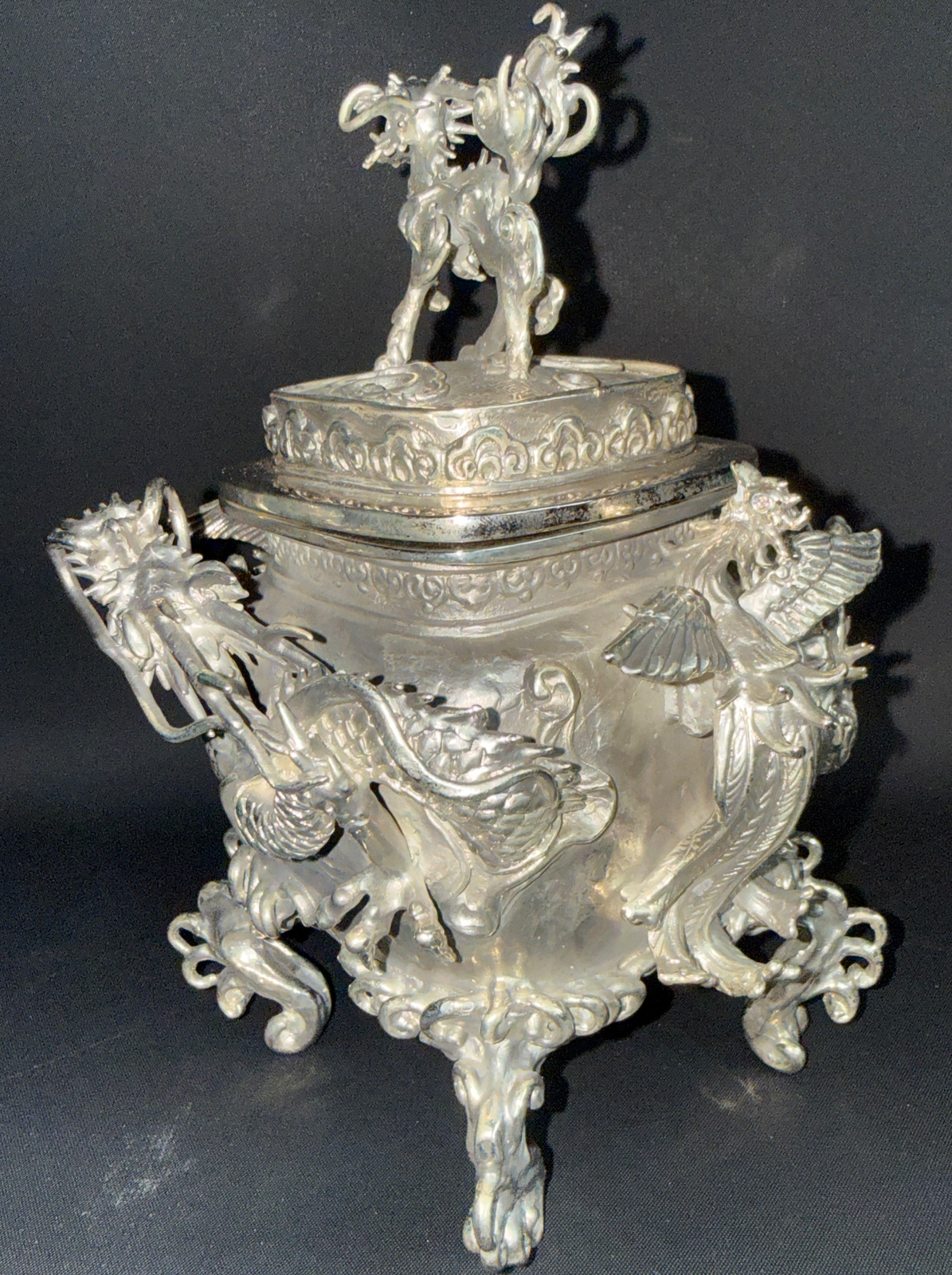 Takaoka Bronze Kōro ACCESSORIES. Close-up: shiny silver incense burner, front view, lid with mythical creature, dragon handles.