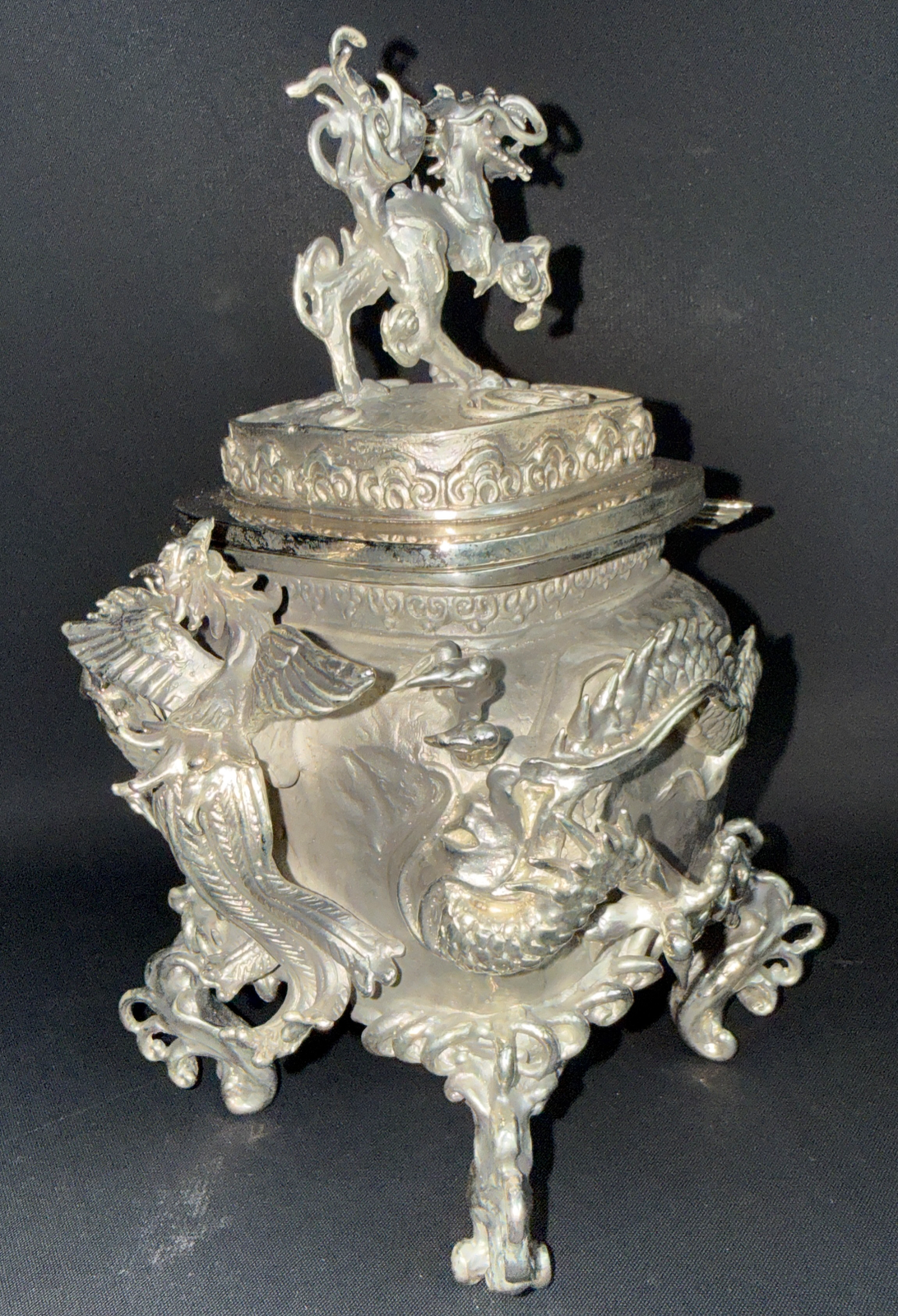 Silver Takaoka Bronze Kōro from side, phoenix and dragon figures adorn ACCESSORIES incense burner, kirin on lid