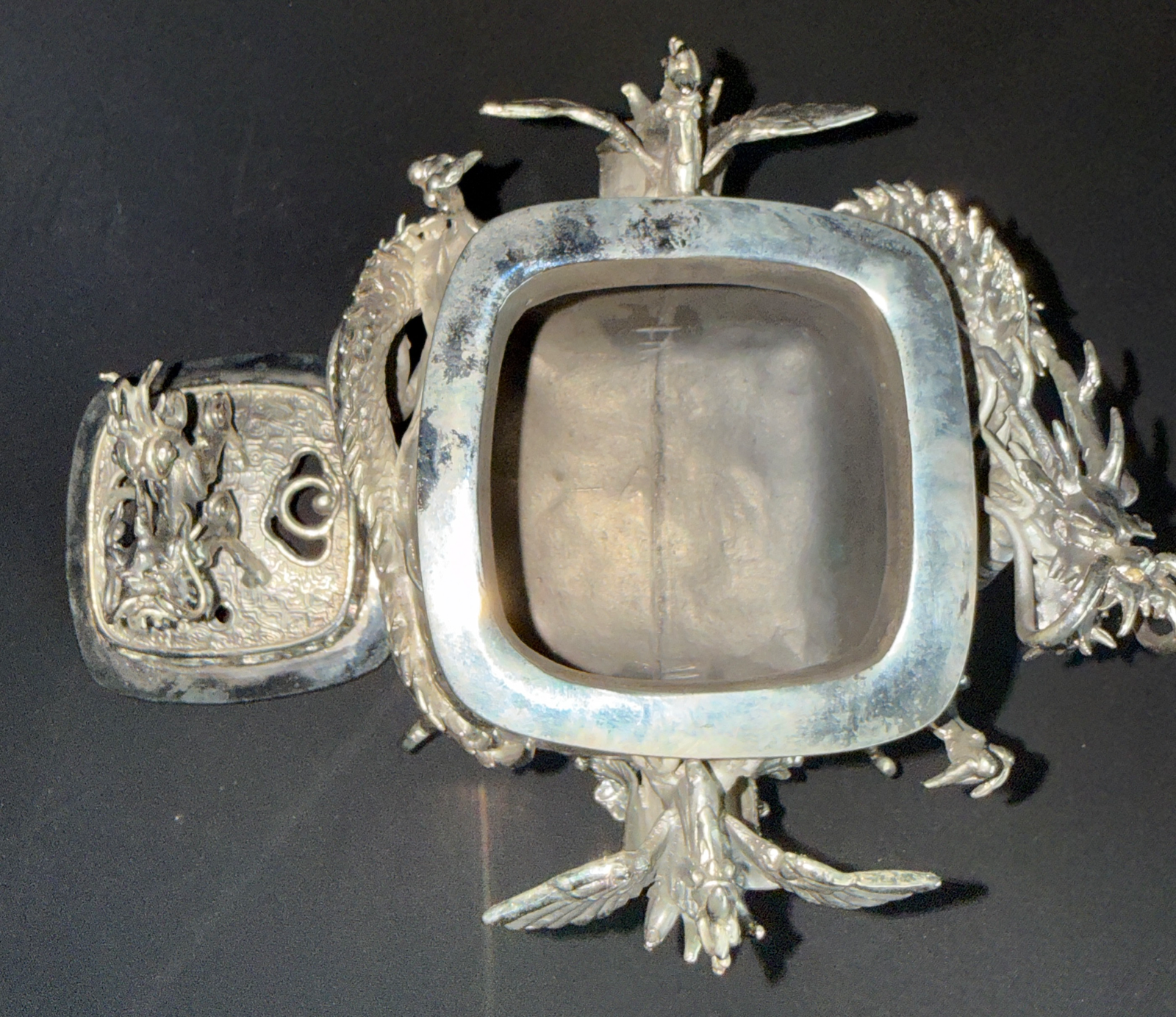 Silver Takaoka Bronze Kōro from above with ornate dragon details, lid ajar. Kyodai Originals ACCESSORIES.