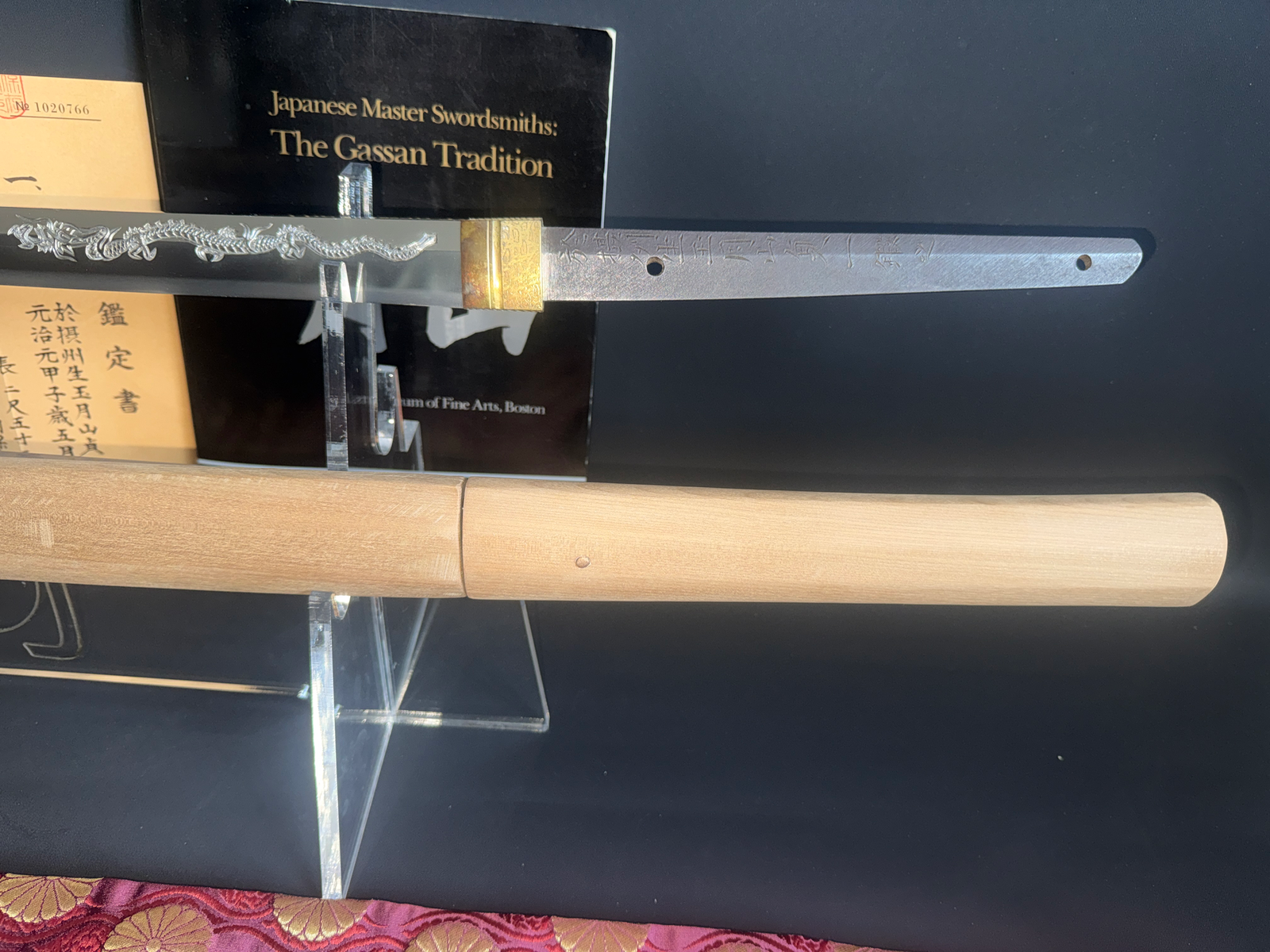 Japanese Masterpiece Katana by Gassan Sadakazu, visible nakago, habaki, and dragon horimono on katana blade