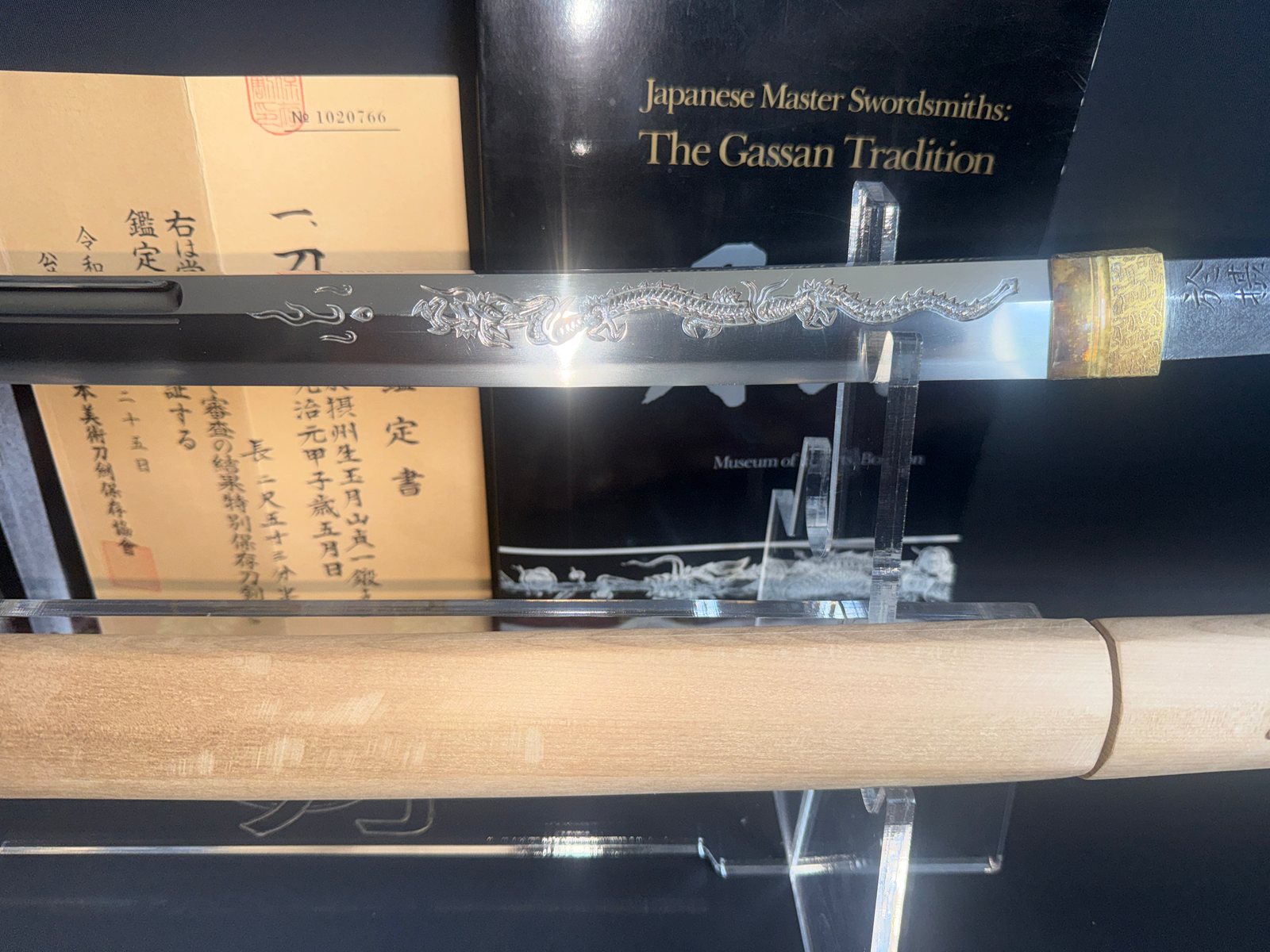 Japanese Masterpiece Katana by Gassan Sadakazu, NBTHK Tokubetsu Hozon, dragon engraving, displayed on stand