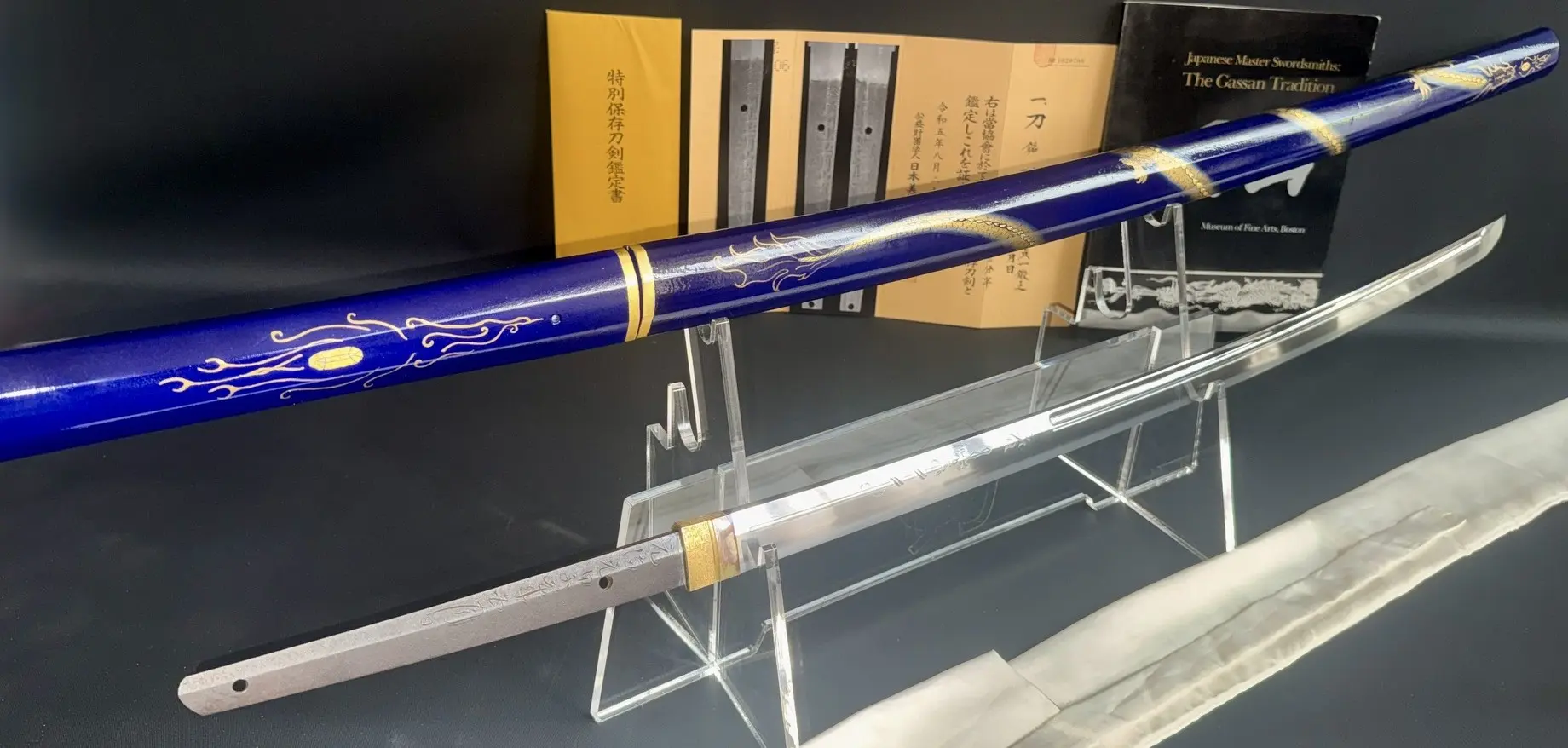 Japanese Masterpiece Gassan Sadakazu NBTHK Tokubetsu Hozon katana with blue saya and visible blade.