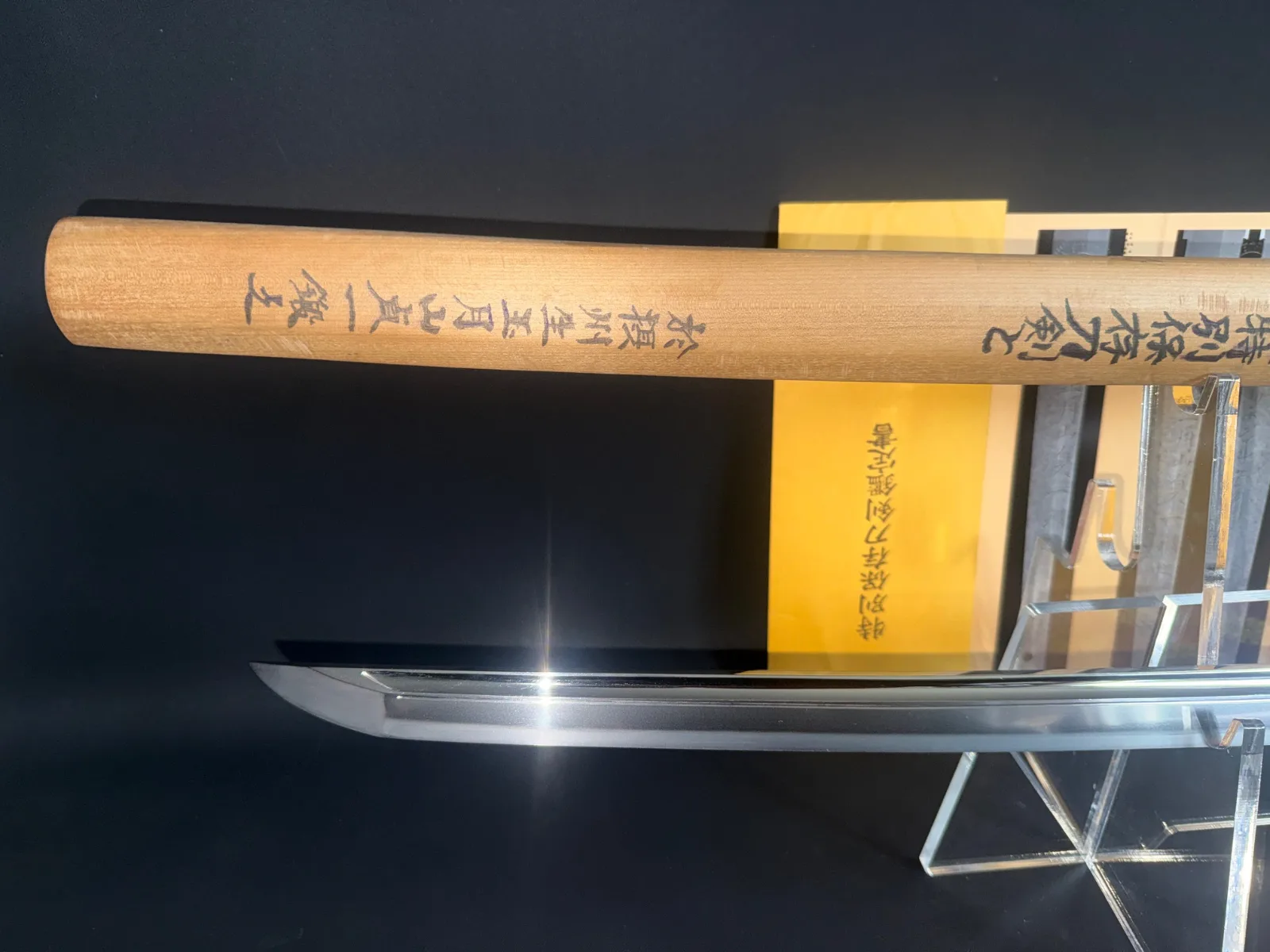 Japanese Masterpiece Katana by Gassan Sadakazu, NBTHK Tokubetsu Hozon, its gleaming blade beside inscribed shirasaya