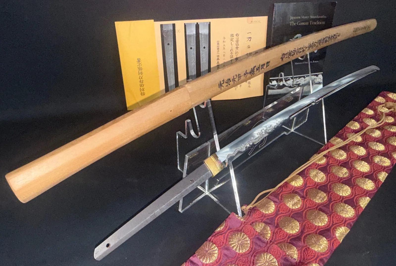 Japanese Masterpiece Katana by Gassan Sadakazu, NBTHK Tokubetsu Hozon, on stand with wooden saya and documents