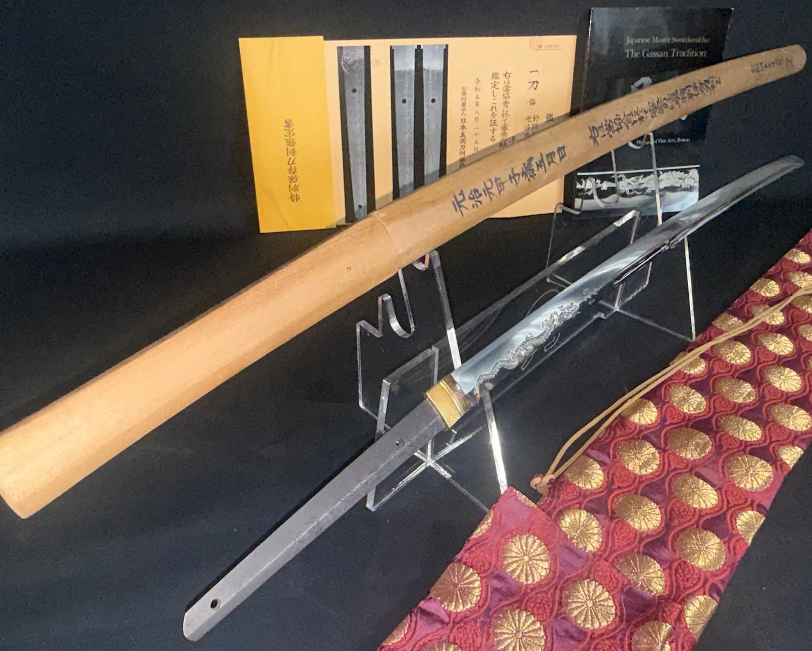 Japanese Masterpiece Katana by Gassan Sadakazu NBTHK Tokubetsu Hozon, blade displayed on stand with shirasaya and bag