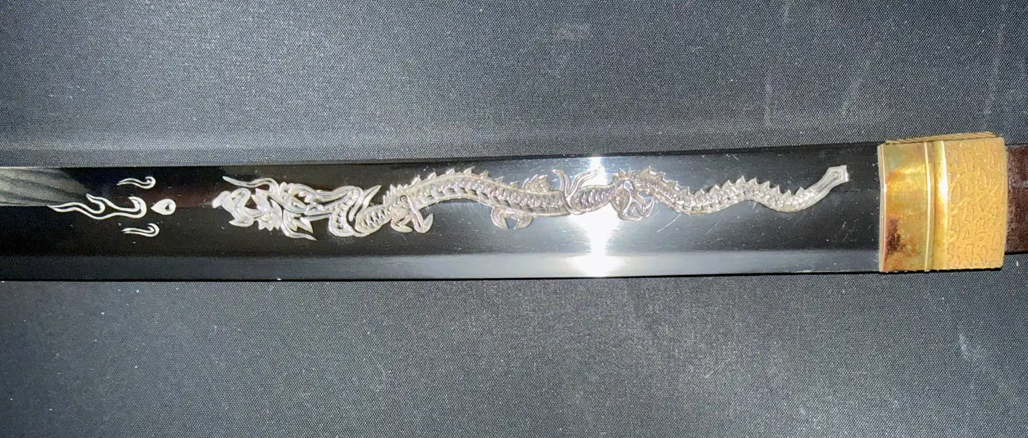 Kyodai Originals Gassan Sadakazu katana blade with detailed silver dragon horimono and golden habaki at the base
