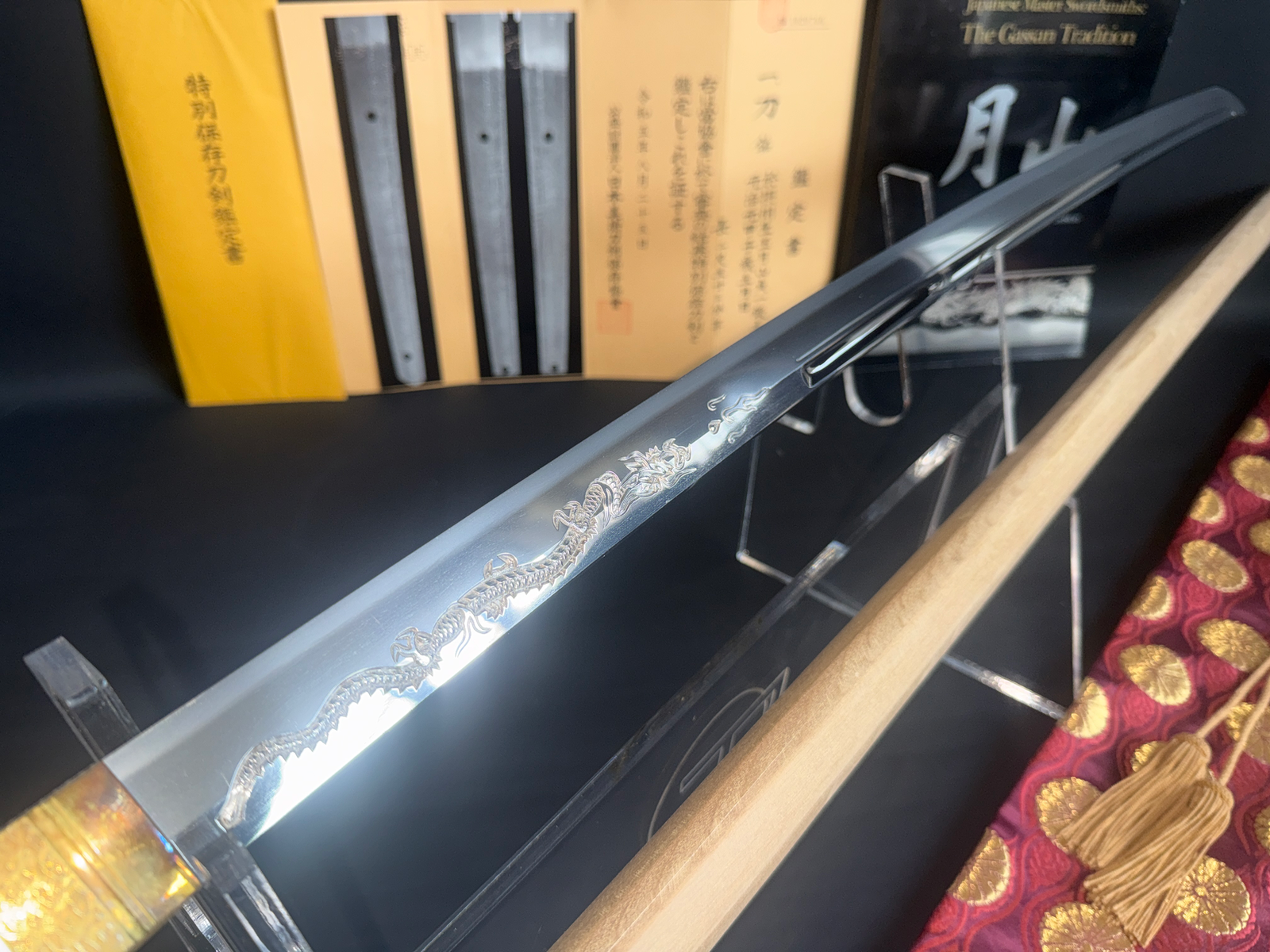 Japanese Masterpiece Katana by Gassan Sadakazu, NBTHK Tokubetsu Hozon, with ornate dragon engraving on blade.