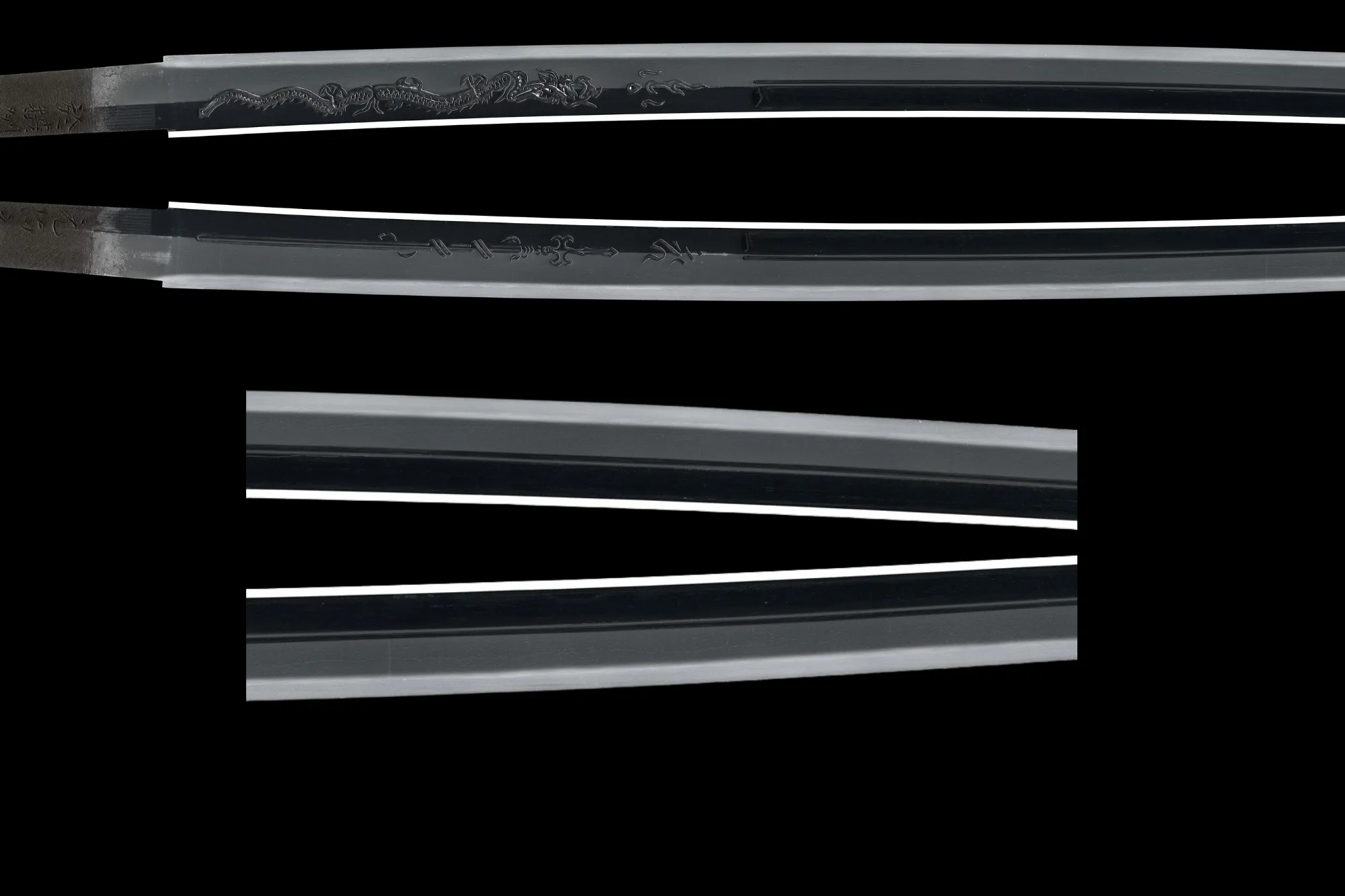 Side view of the Gassan Sadakazu NBTHK Tokubetsu Hozon katana blade with intricate engravings.