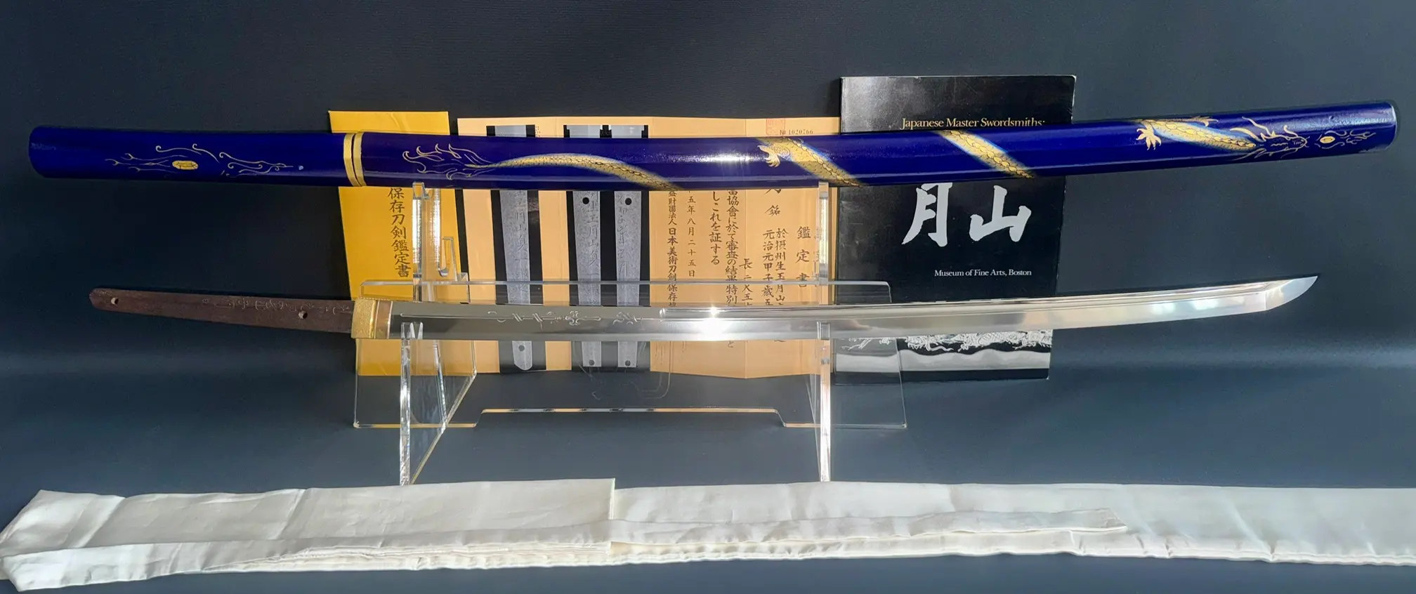 Japanese Masterpiece Gassan Sadakazu NBTHK Tokubetsu Hozon katana with blue saya and blade on stand