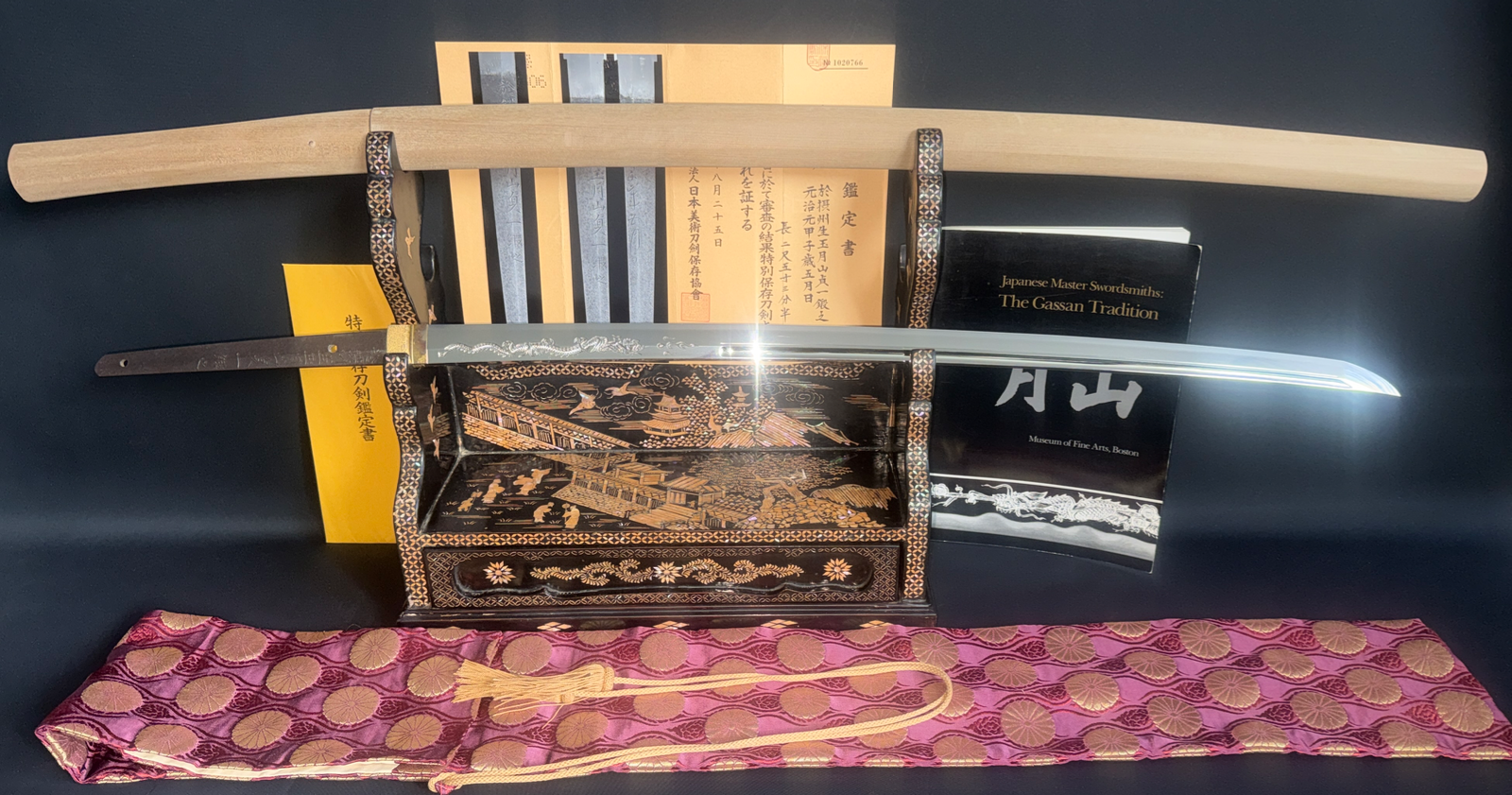 Japanese Masterpiece Katana by Gassan Sadakazu, NBTHK Tokubetsu Hozon documented, on an ornate stand with papers
