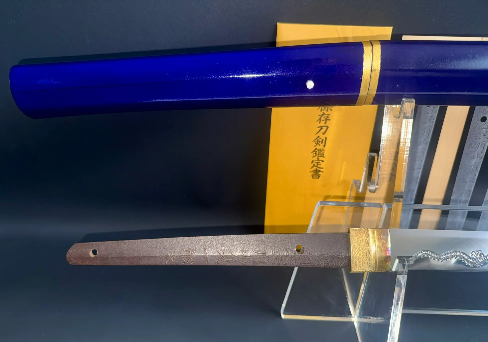 Gassan Sadakazu NBTHK Tokubetsu Hozon katana with blue saya & exposed tang with inscription, top view
