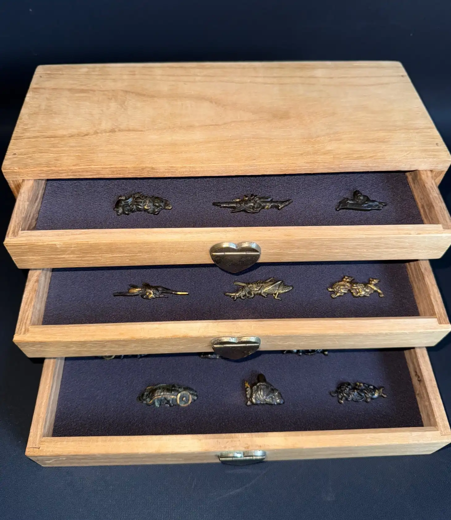 Edo period Menuki 9 pairs in open Kiri box, small samurai sword accessories in wood drawers slightly pulled out