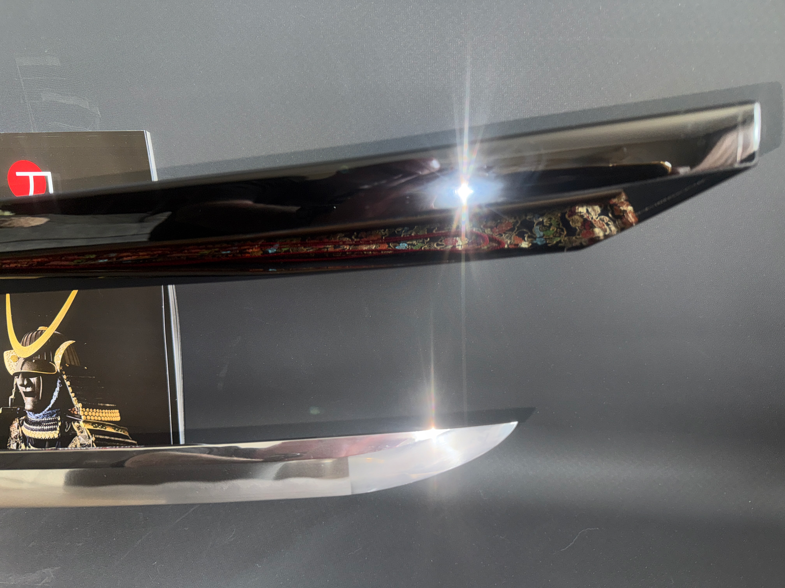 Jinja Hōnō Tachi Naganobu Katana blade tip & saya mouth with intricate ornate details, close-up view.