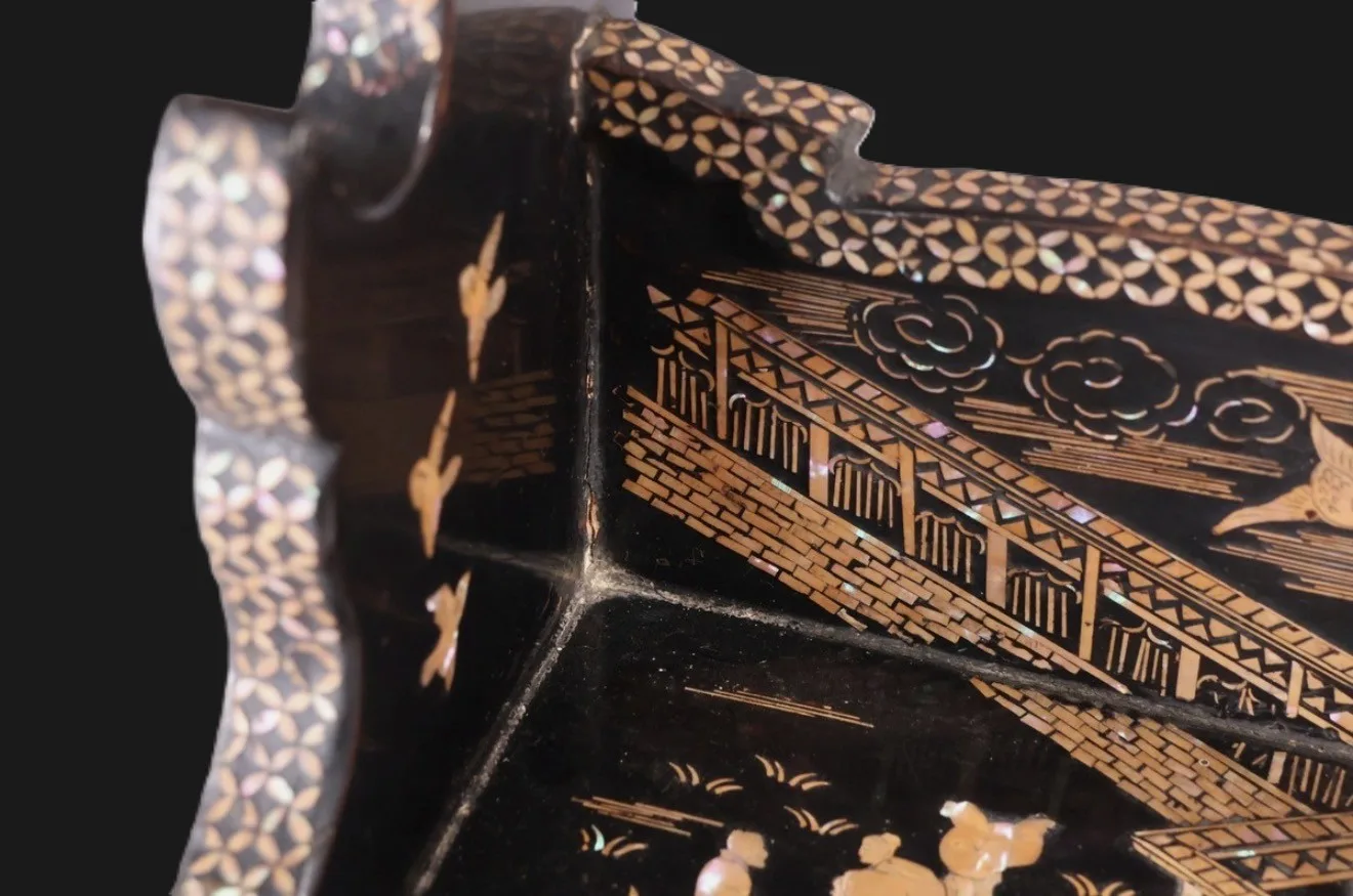Close-up of a Meiji Period Antique Japanese Three-Sword Katana Kake showing intricate raden inlay on the katana stand.