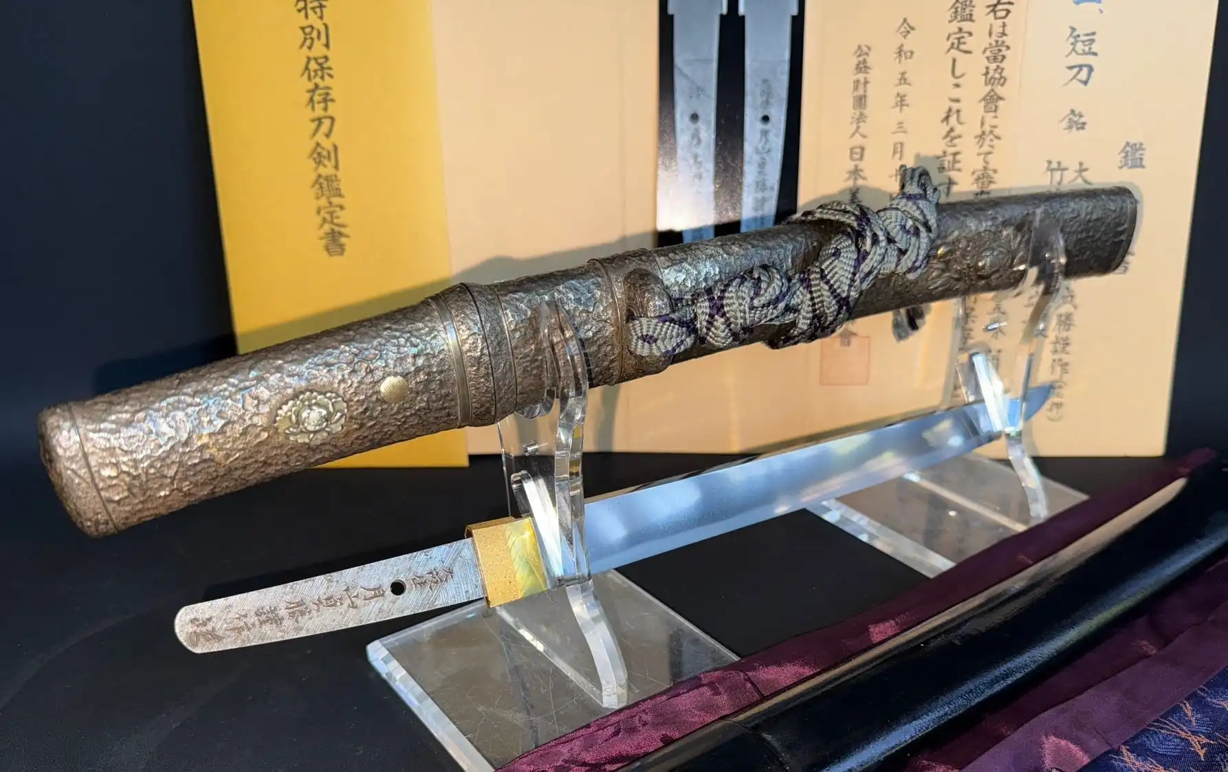 Tanto Gassan Sadakatsu (Japanese Dagger) with detailed scabbard and partially visible blade, plus paperwork
