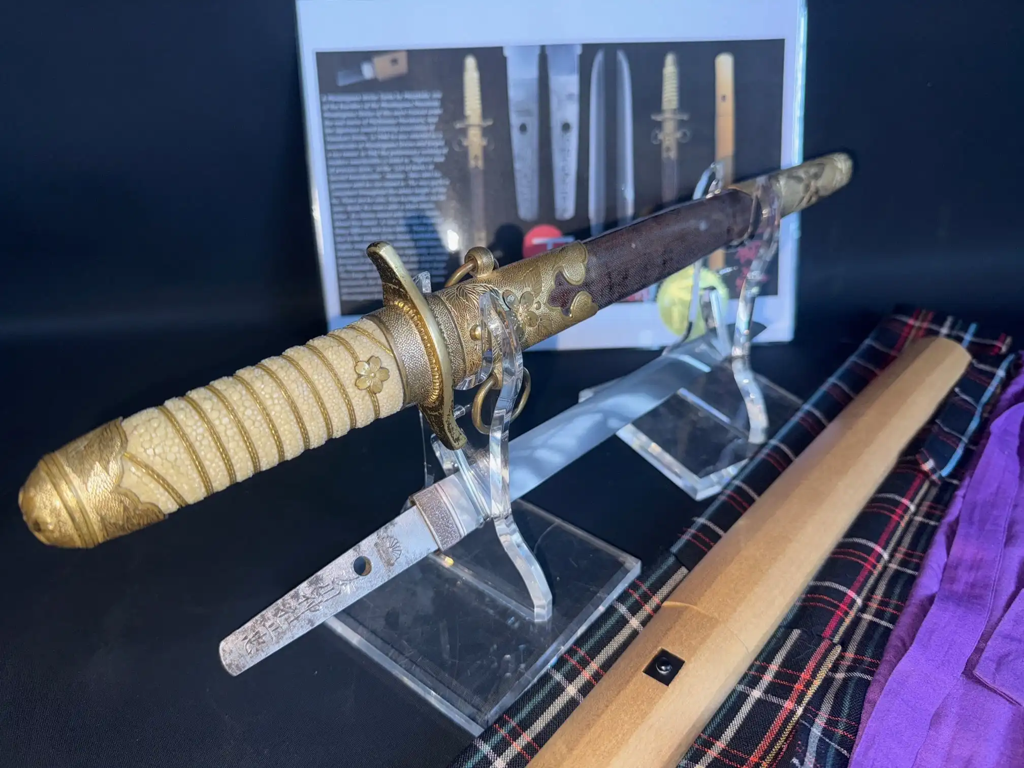 Minatogawa Tanto Masatada, a Japanese military tanto with original koshirae, on display angled left