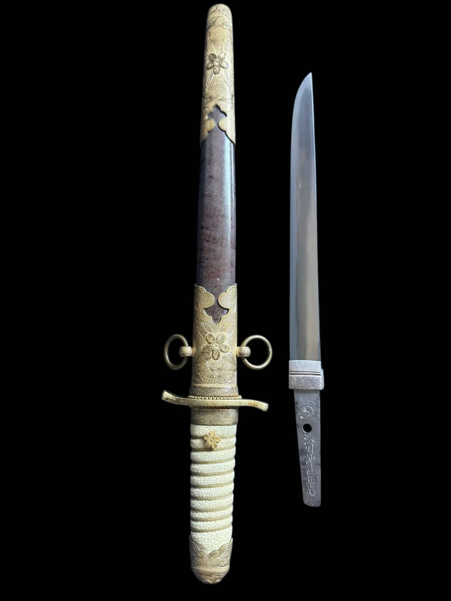 Minatogawa Tanto Masatada, rare Japanese Navel Tanto with ornate koshirae and exposed blade on black background