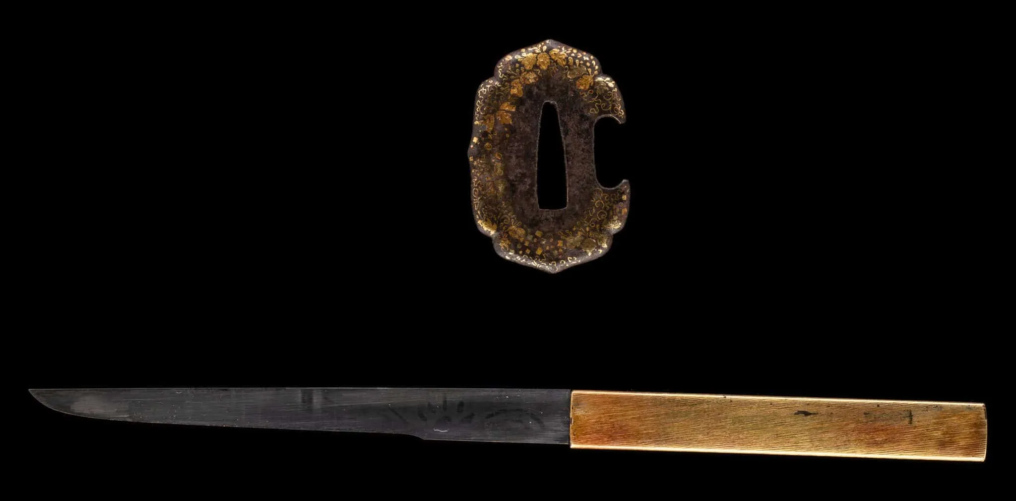 Tantō Muramasa Demon Steel with gold-patterned tsuba and polished blade, on display as a Kyodai Originals product