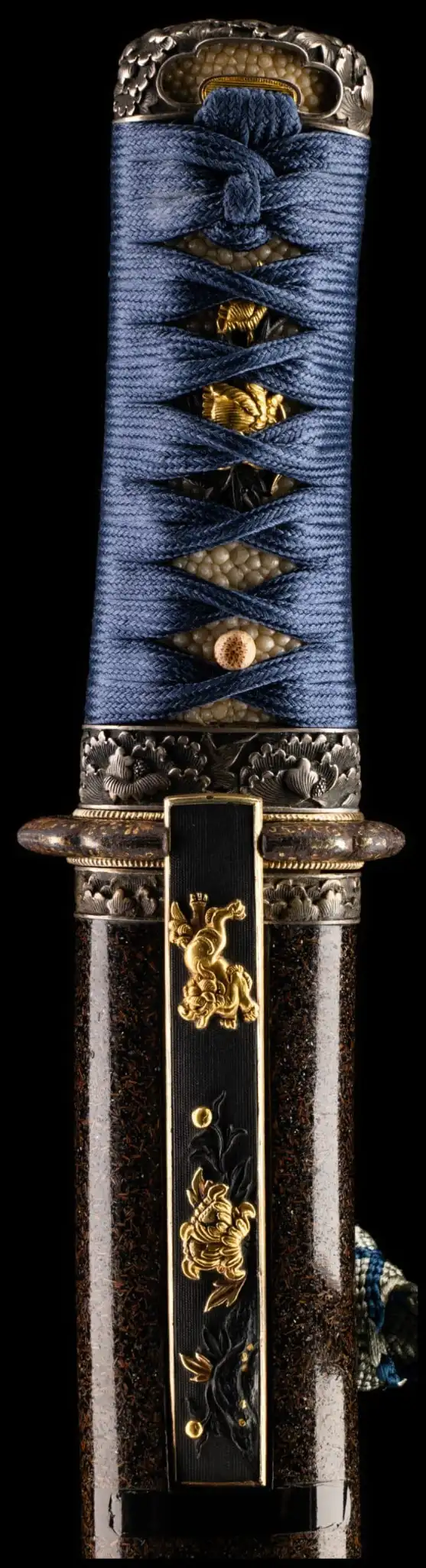 Close-up of a Tantō Muramasa Demon Steel blade with ornate blue Ito wrapping and golden accents