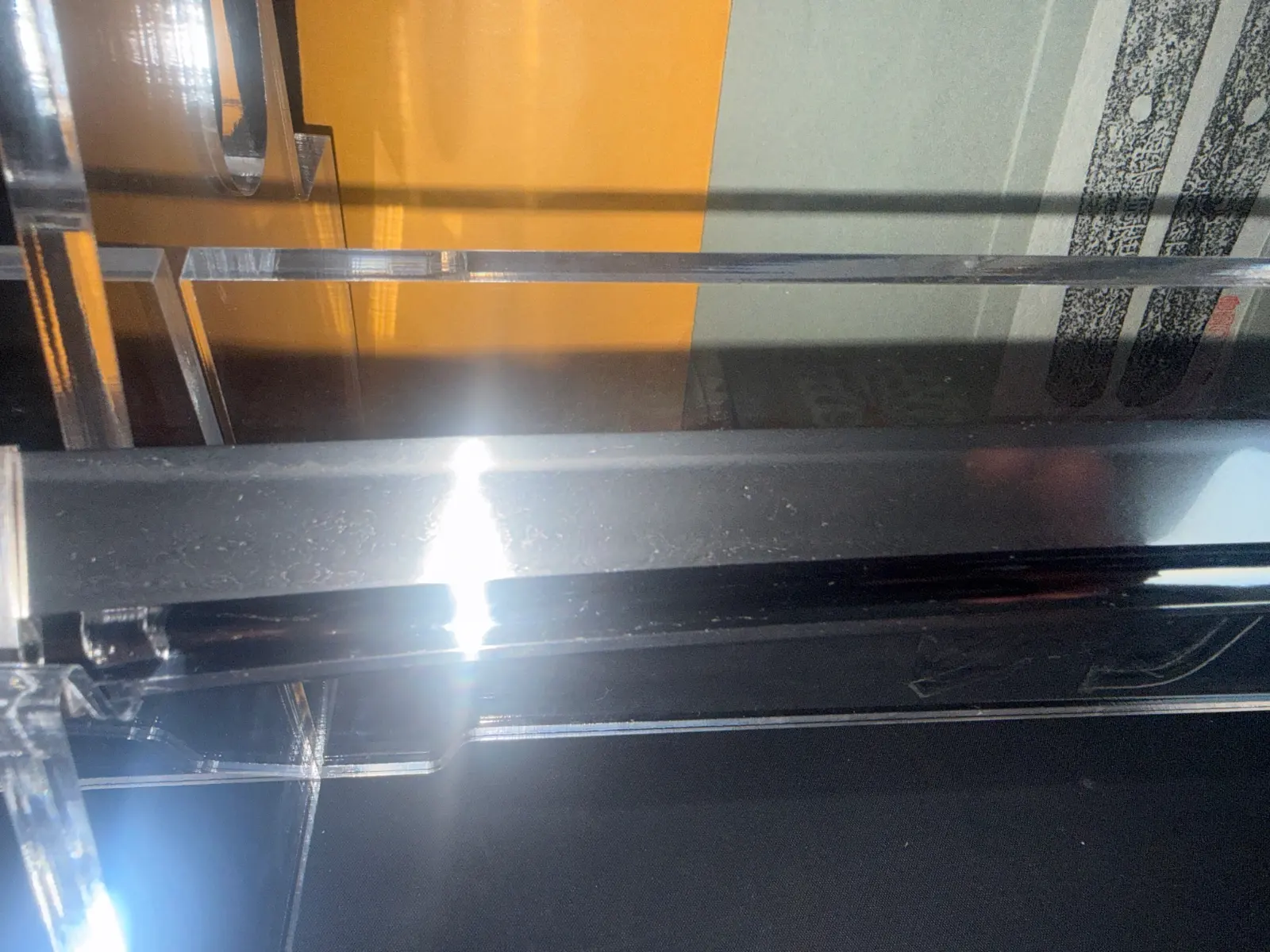 Naruse Family Heirloom Katana 1562 blade in display stand, with sun glare on the polished steel