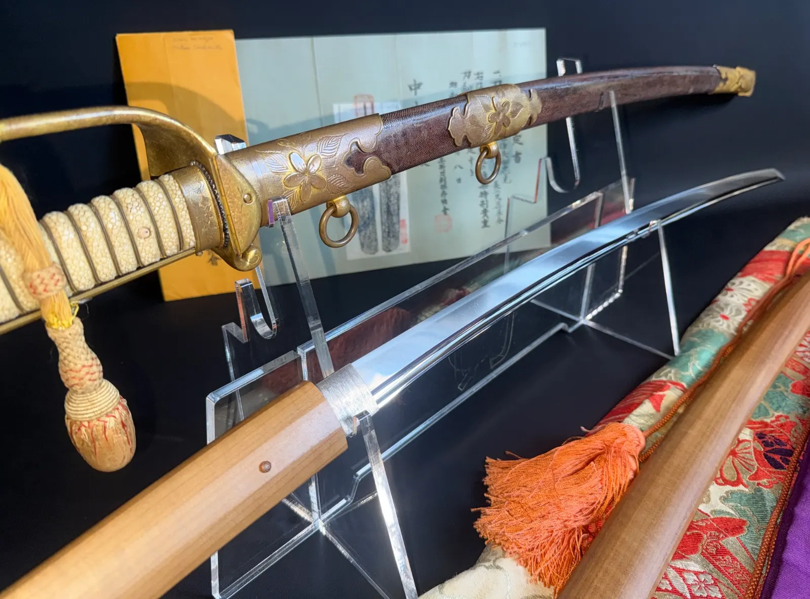 Naruse Family Heirloom Bizen Osafune Tadamitsu katana in Kyū Guntō koshirae on stand, polished blade visible