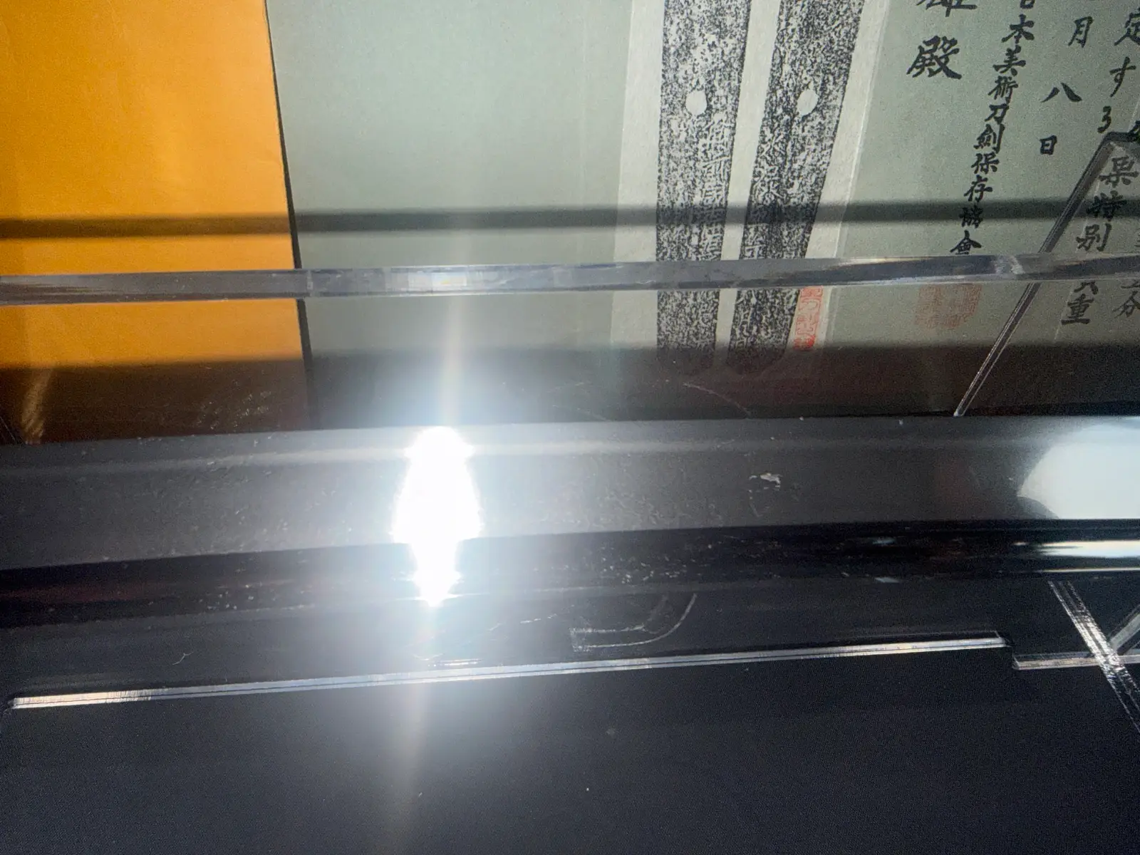 Close-up of a Naruse Family Heirloom Bizen Osafune Tadamitsu Katana blade, with light reflecting off its surface