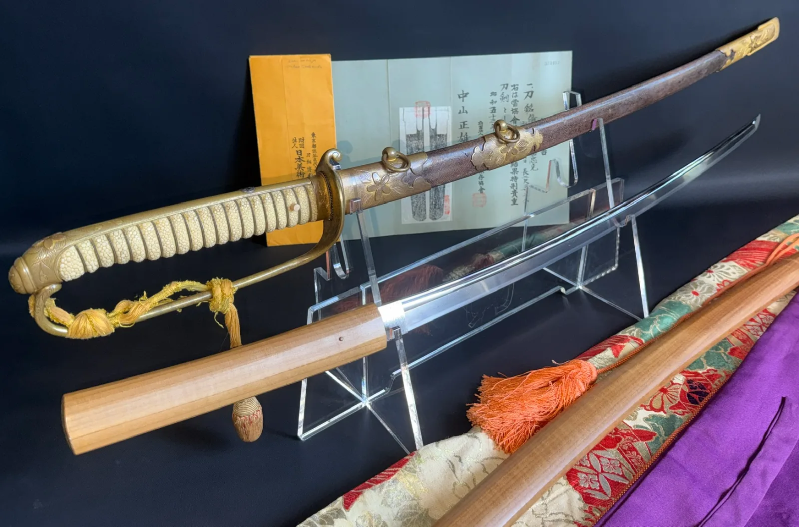 Naruse Family Heirloom Bizen Osafune Tadamitsu katana in Navy koshirae, blade and mounts visible on stand