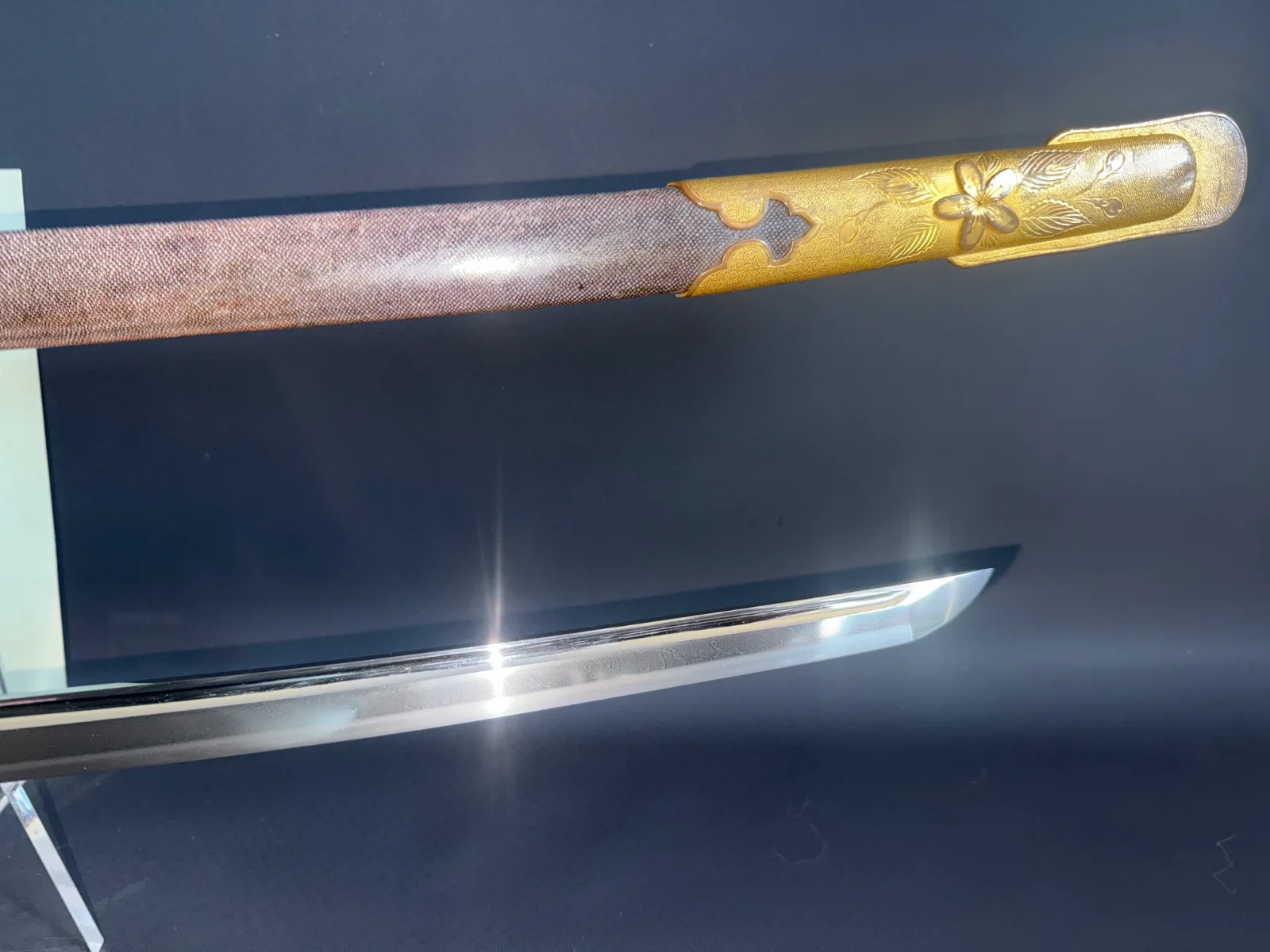 Naruse Family Heirloom Bizen Katana, close up of the shining blade and gilded koshirae with floral motif