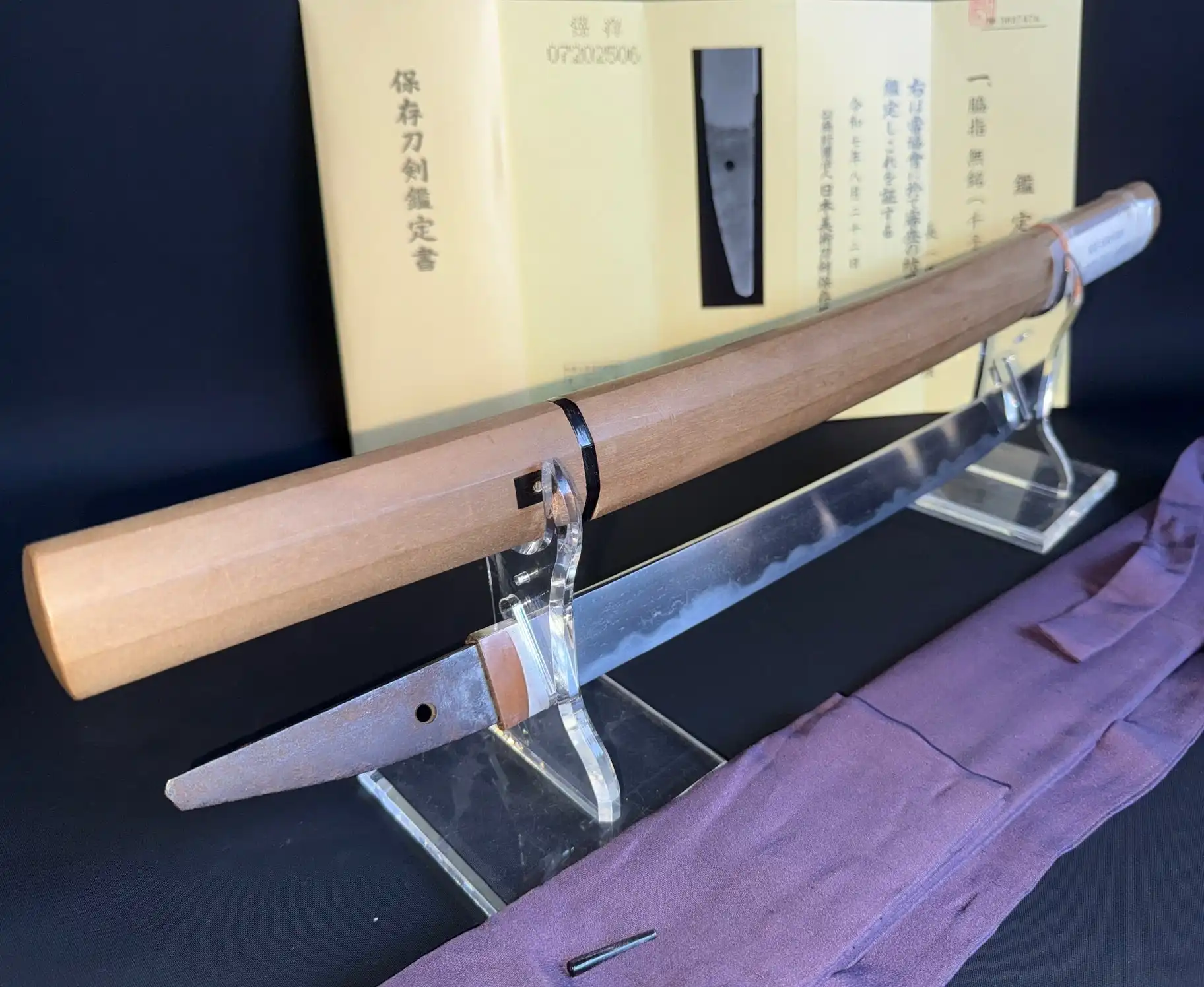 Mumei Wakizashi Sengo Muramasa, Koto period wakizashi blade on a stand with a shirasaya and certificate
