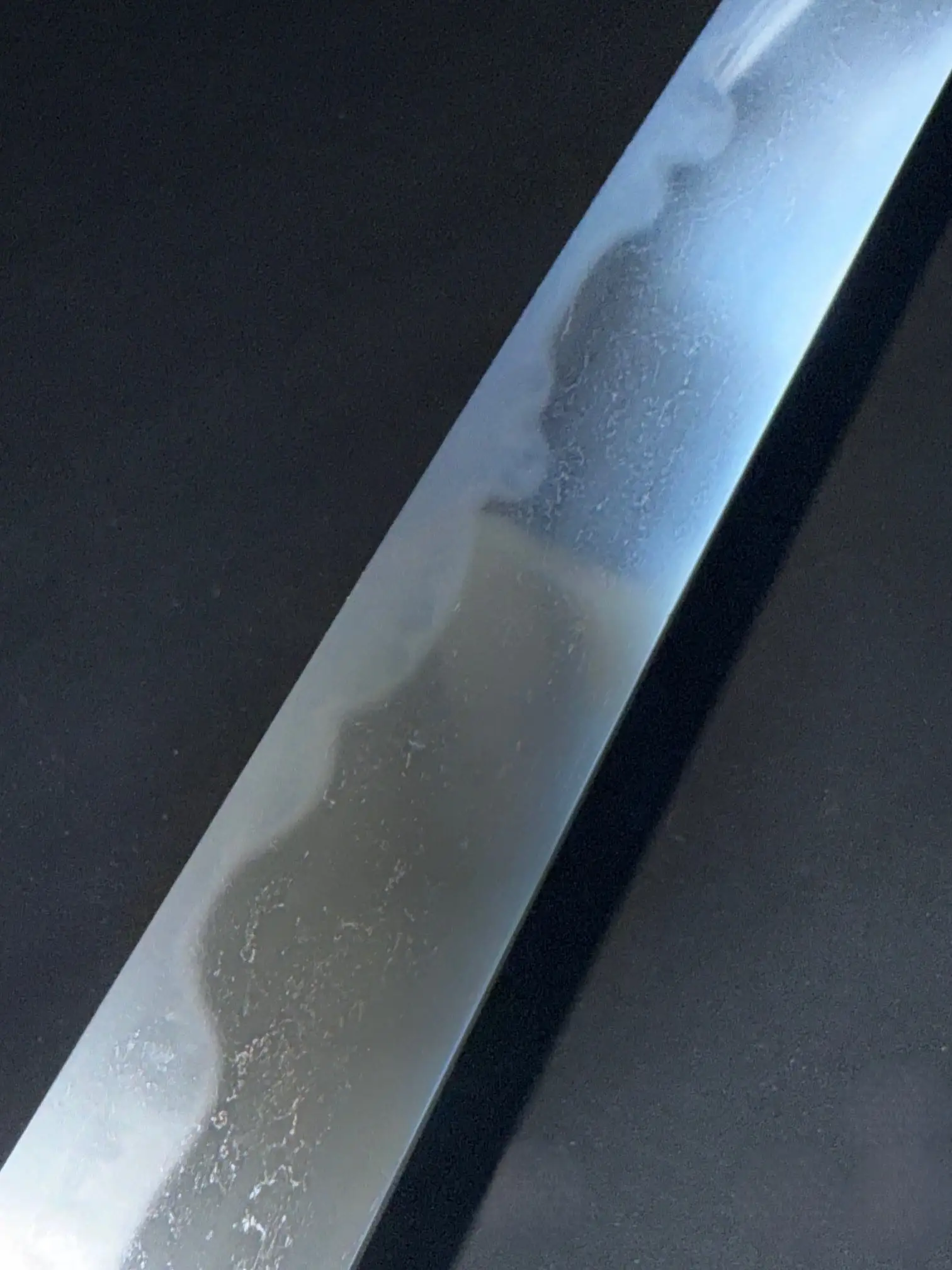 Close-up of the Mumei Wakizashi Sengo Muramasa blade showing the hamon and polished surface.