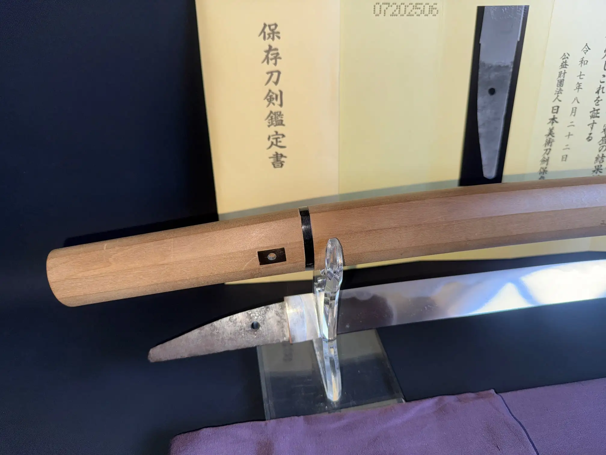Mumei Wakizashi Sengo Muramasa, Koto Period, with its sharp blade exposed and certificate in background