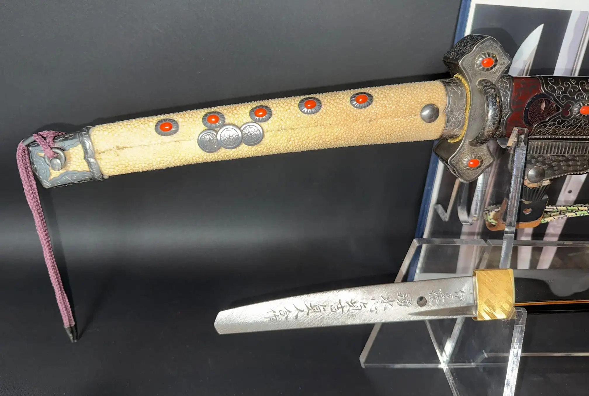 Close-up of the scabbard and tang of the Tachi Katana Sadayoshi/Sadahito, a Japanese katana sword.