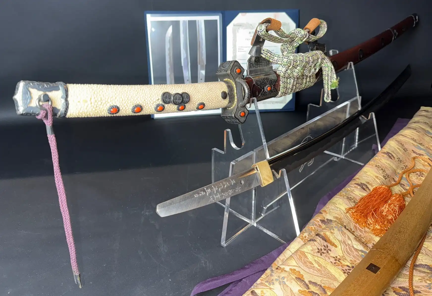 Tachi Katana Sadayoshi/Sadahito, a collaborative katana sword and scabbard on display with fittings