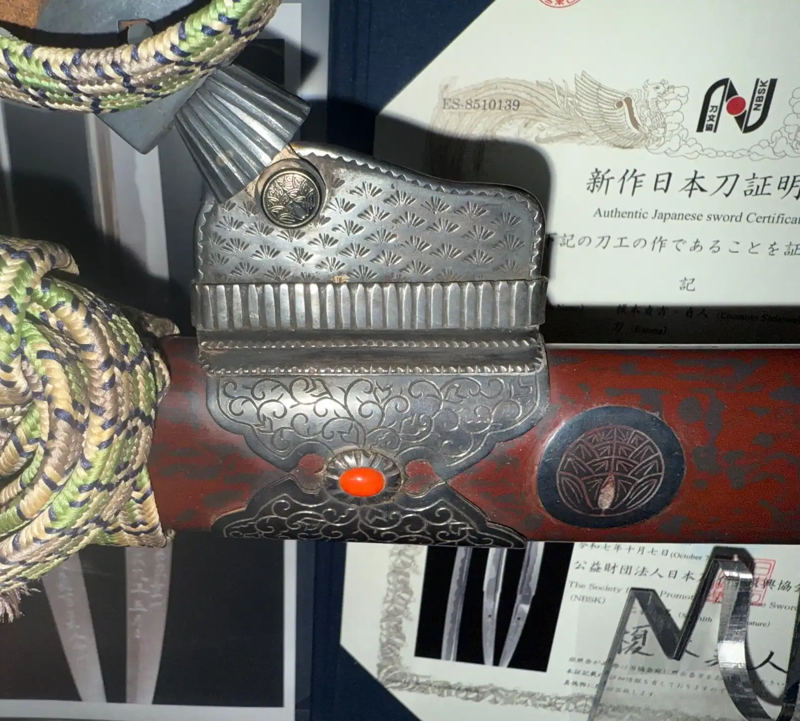 Close-up of the ornately decorated scabbard and fittings of the Tachi Katana Sadayoshi/Sadahito