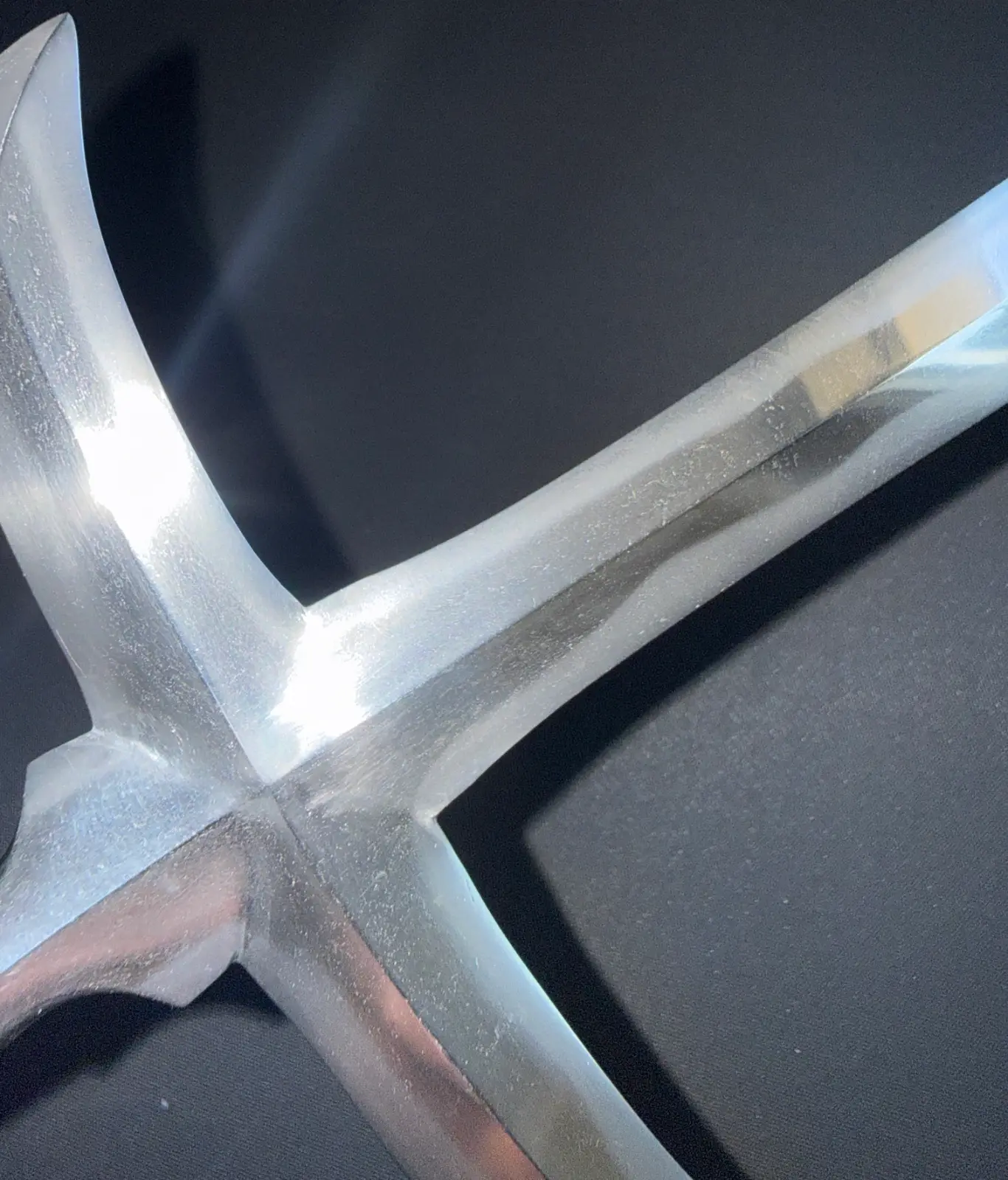 Close-up of a gleaming silver Ichimonji-Yari blade showing its unique shape. Japanese Yari spear or Naginata antique.