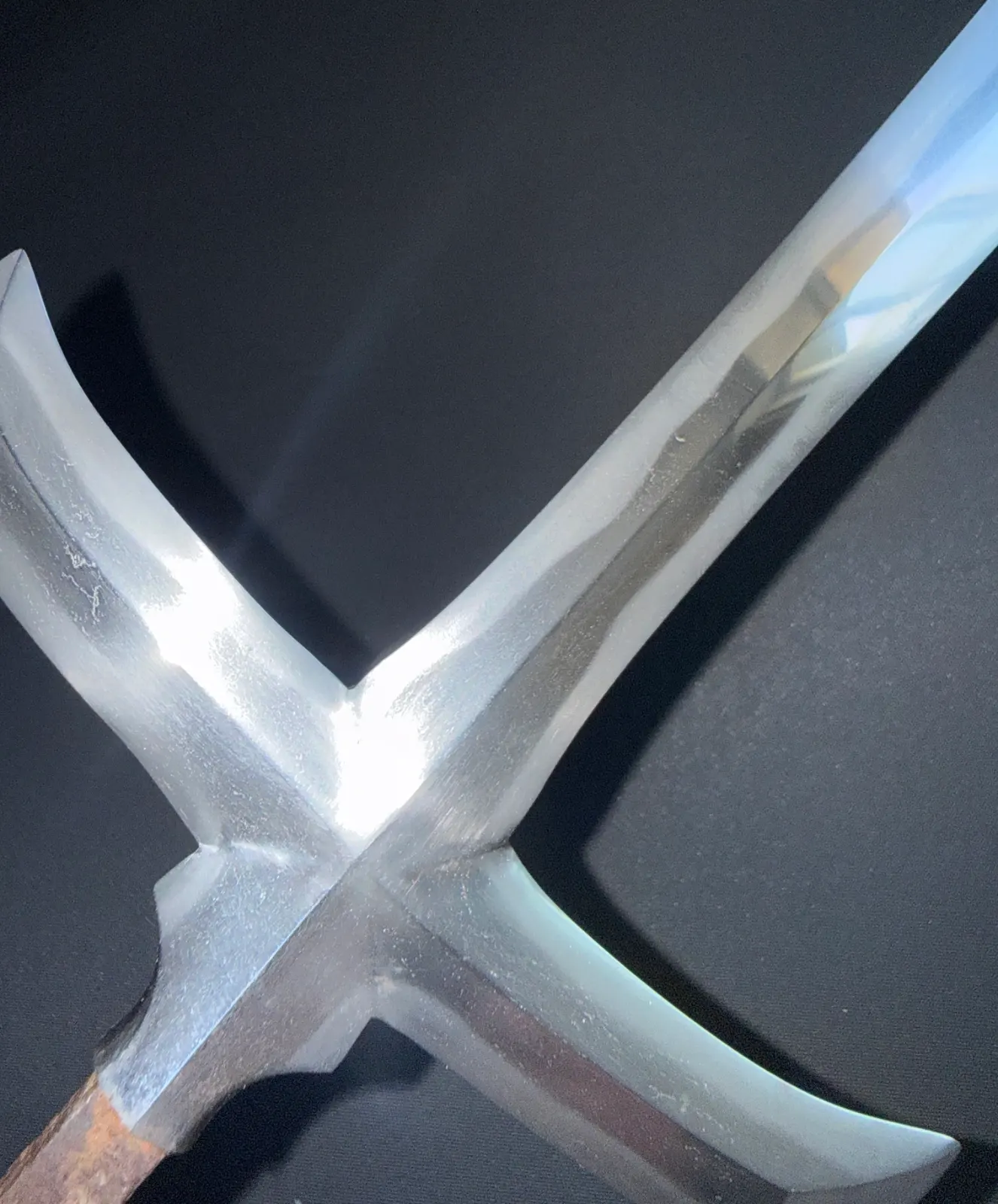 Close-up, shiny blade of a Rare Ichimonji-Yari by Kanemasa (Yari / Naginata) against a dark background