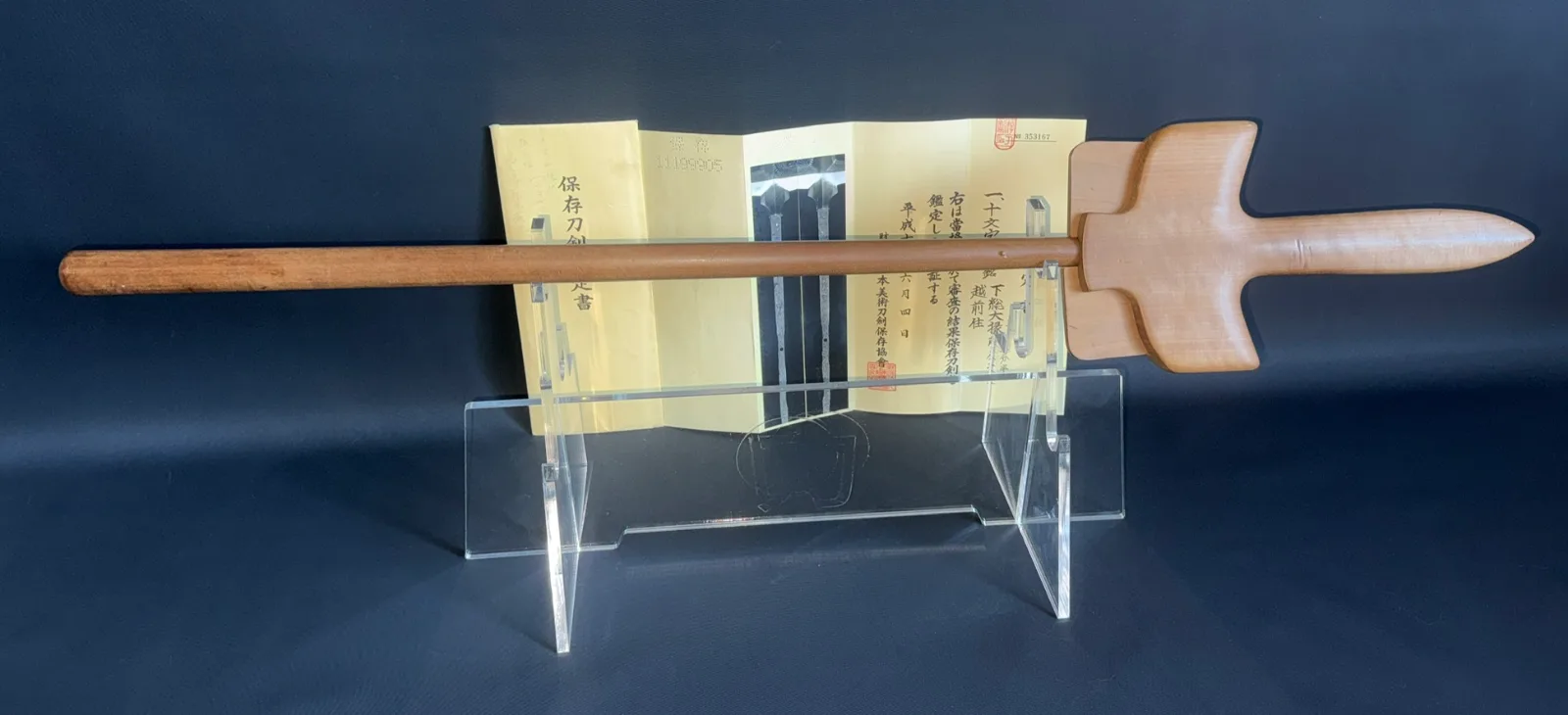 Rare Ichimonji-Yari by Kanemasa in wooden saya on a stand, with NBTHK Hozon certificate behind. Yari weapon.