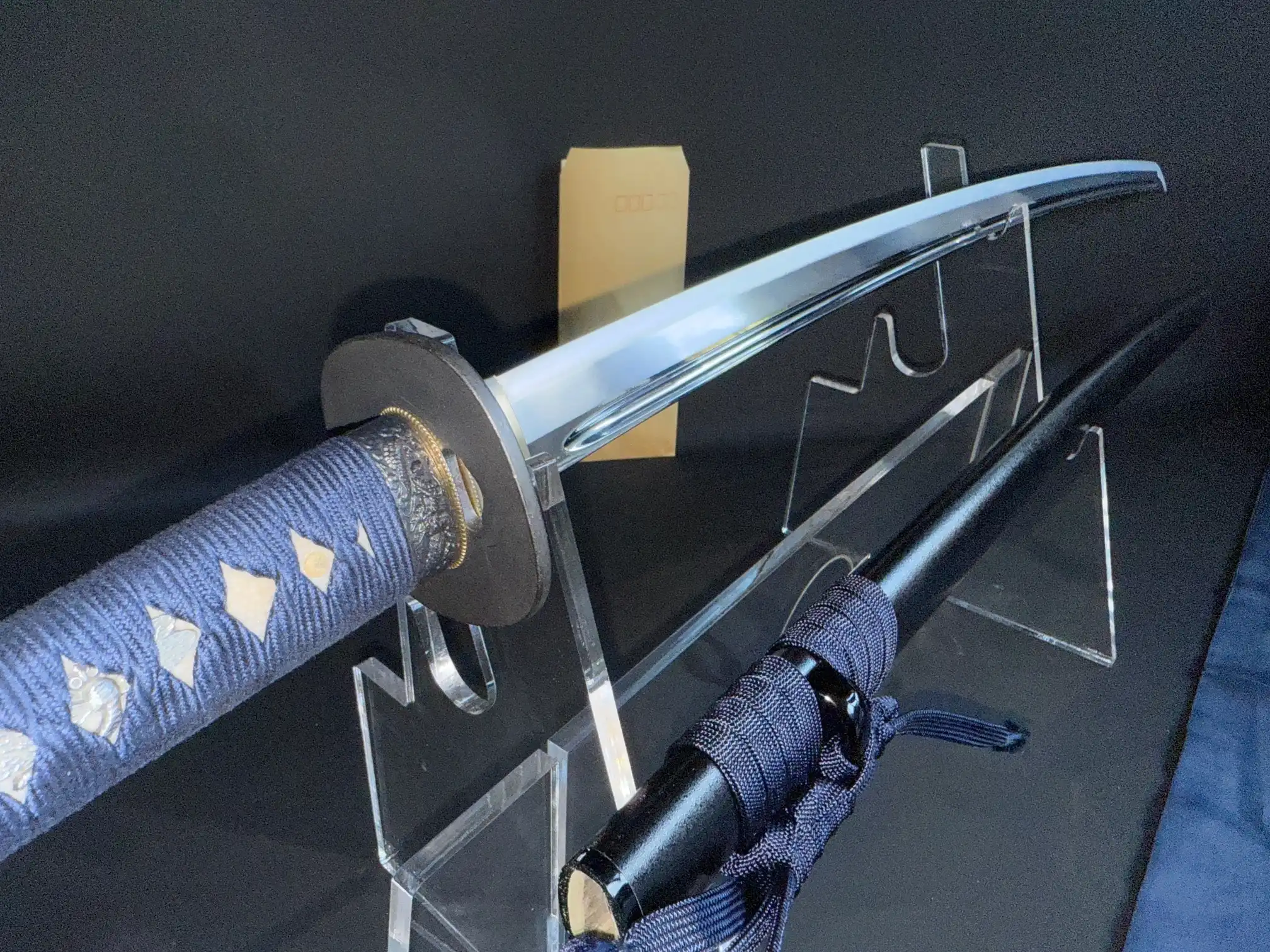 New IAITO MINOSAKA TOKUSEI Japanese Iaido sword with blue tsuka-ito and black saya on stands