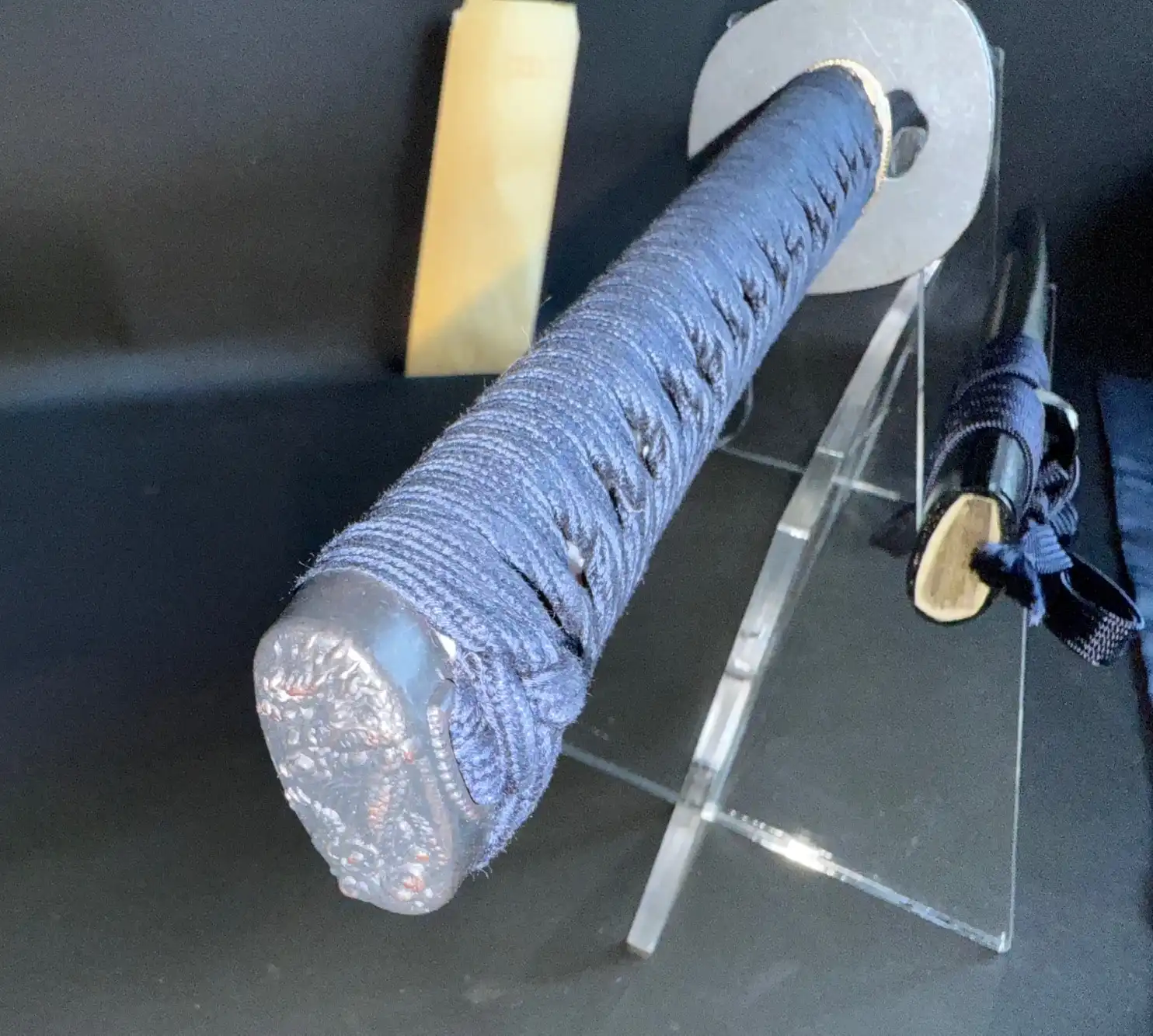 Close-up of a New IAITO MINOSAKA TOKUSEI Japanese Iaido sword handle with dark blue wrap and ornate pommel